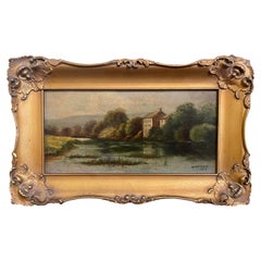 Pittura ad olio dei primi del Novecento con cornice River Side Chateau, firmata W. Baldwin