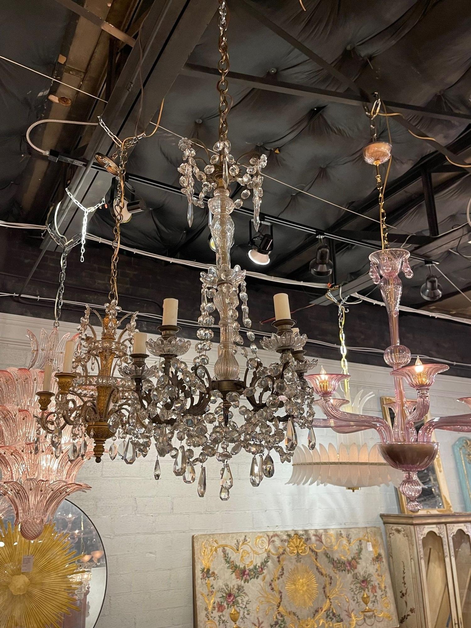 Early 20th century petite French crystal 5-light chandelier. Circa 1920. The chandelier has been professionally re-wired, cleaned and is ready to hang. Includes matching chain and canopy.