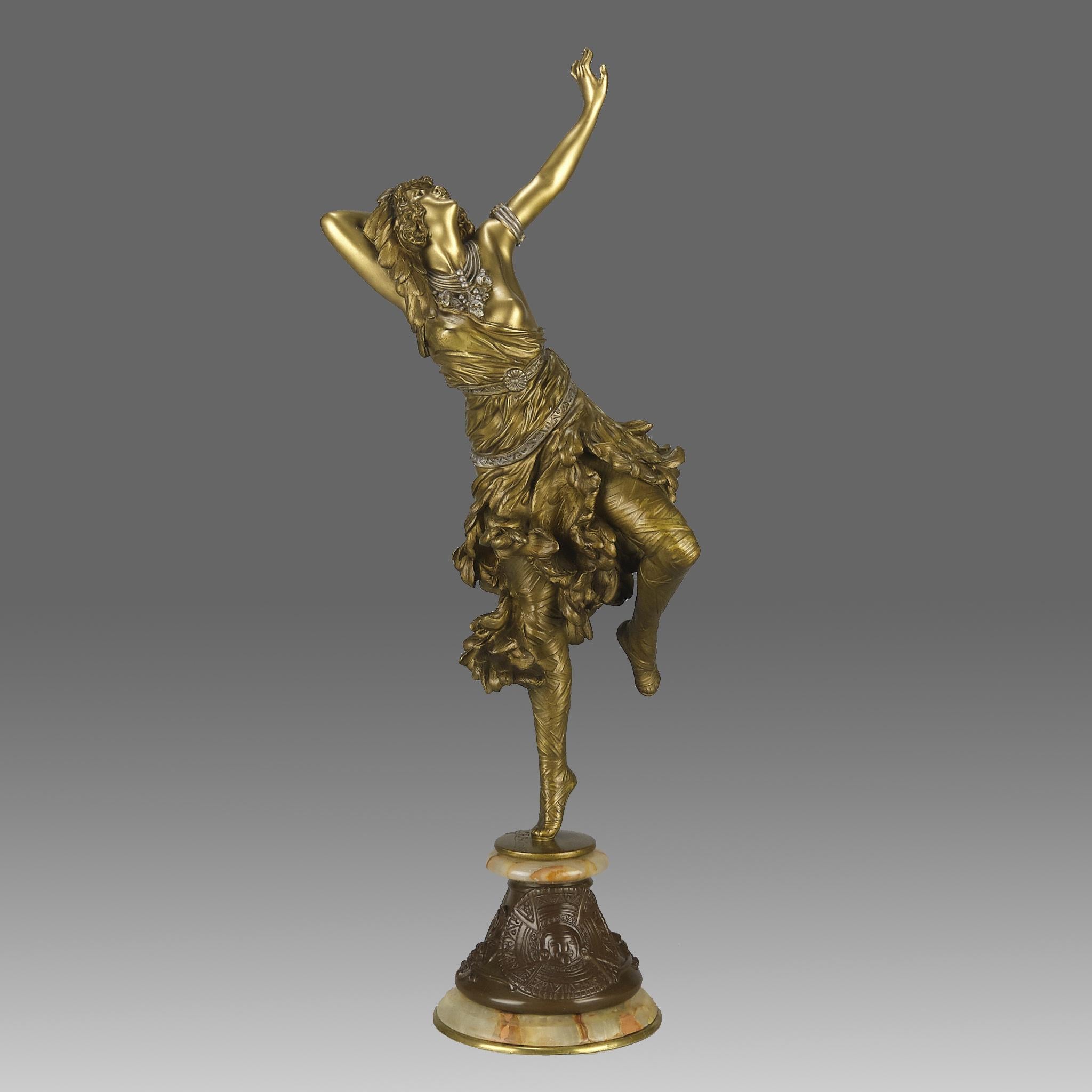 An exquisite early 20th Century French Art Deco gilt bronze figure of a beautiful Oriental dancer wearing a loosely fitted dress balanced on one leg in a dancing pose. The bronze exhibiting excellent detail and colour, signed Cl.J.R.Colinet