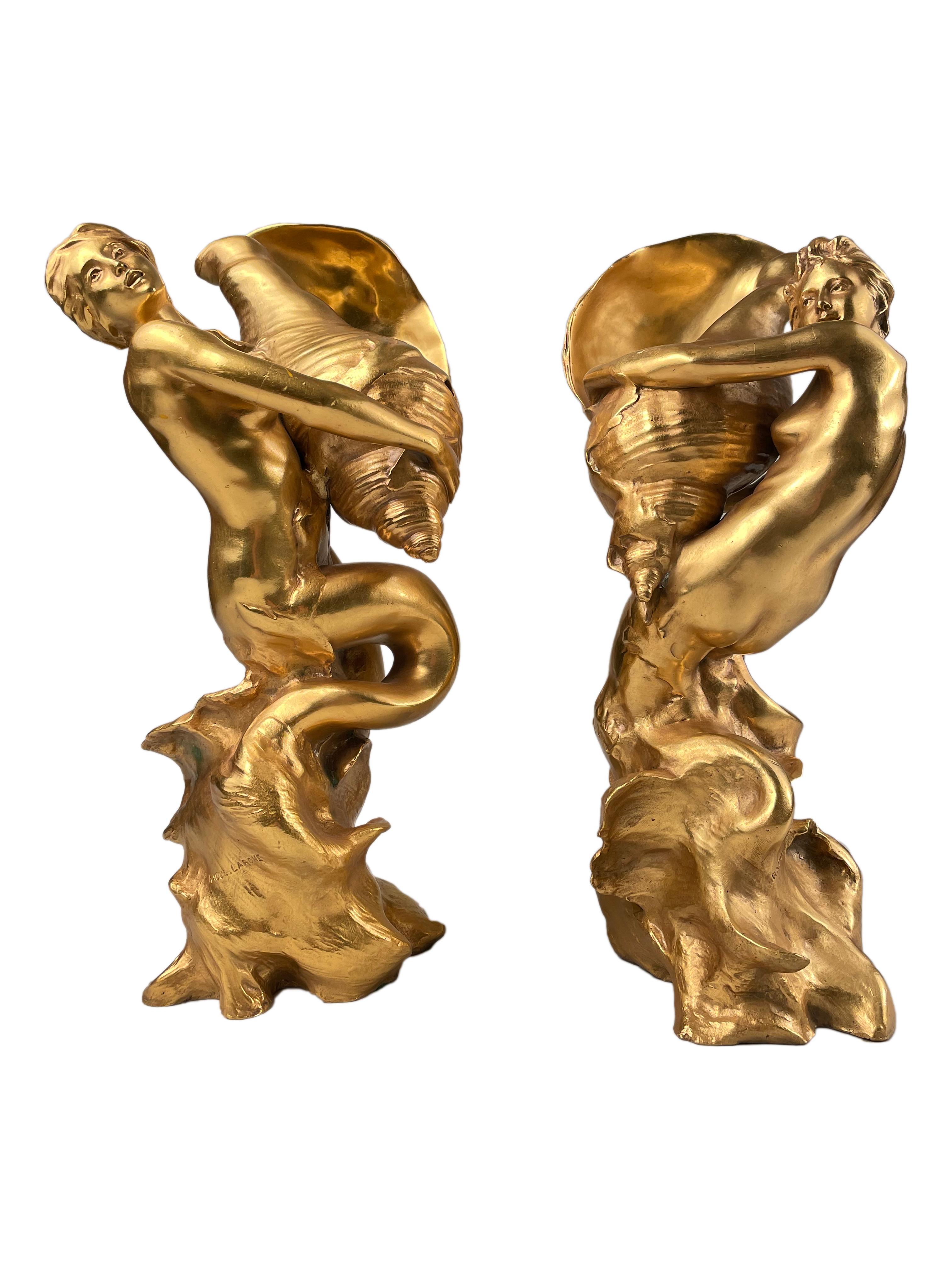 An important pair of early 20th century French Art Nouveau gilt and cast bronze sculptures titled 