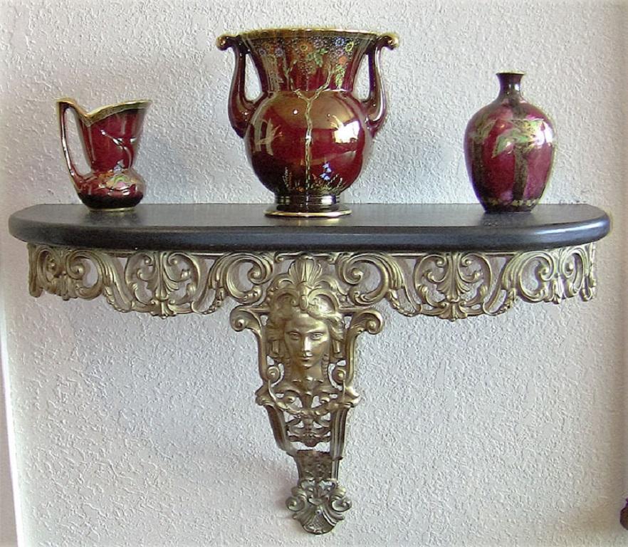 Early 20th century, Art Nouveau style brass wall bracket shelf.

Beautiful quality brass casting with ladies face to the front and an ebonized wooden shelf.

Probably French, circa 1915.

Art Nouveau: Art Nouveau (French pronunciation: [a?