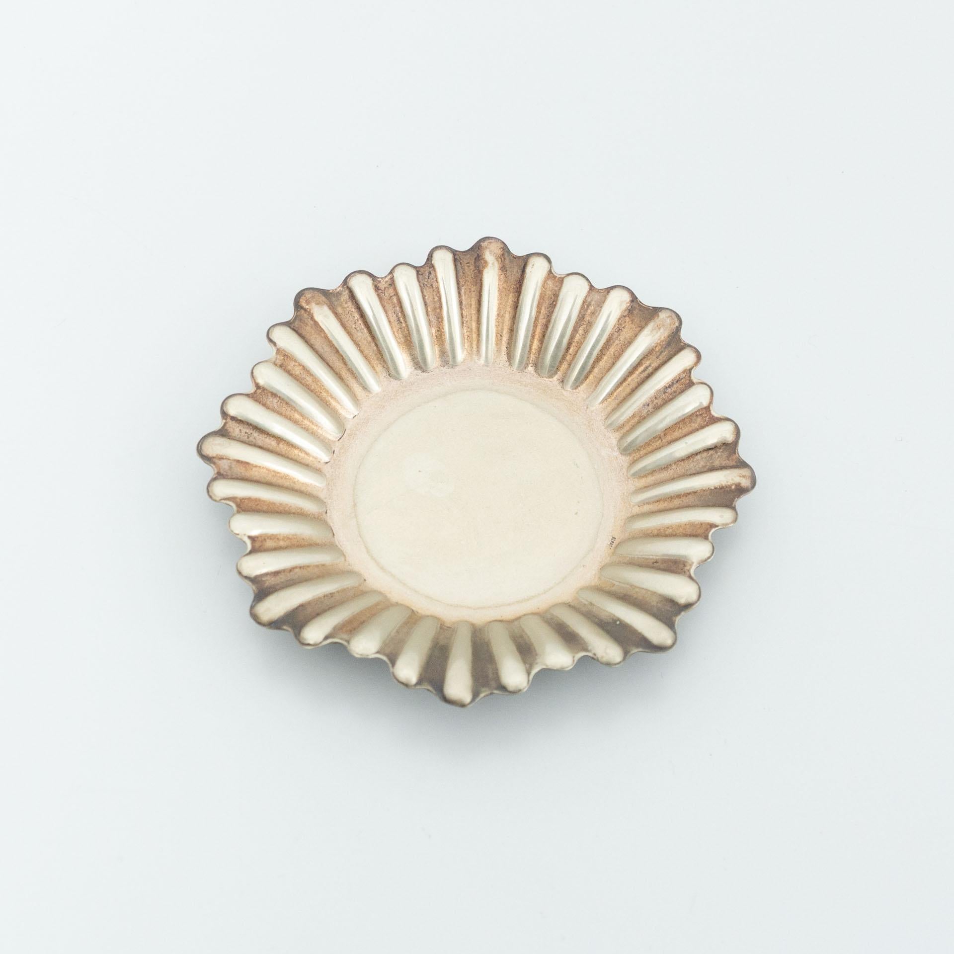 Metal ashtray by unknown manufactured from France, circa early 20th century.

In original condition, with minor wear consistent with age and use, preserving a beautiful patina.

Material:
Metal

Dimensions:
Ø 15 cm x H 1.5 cm.
