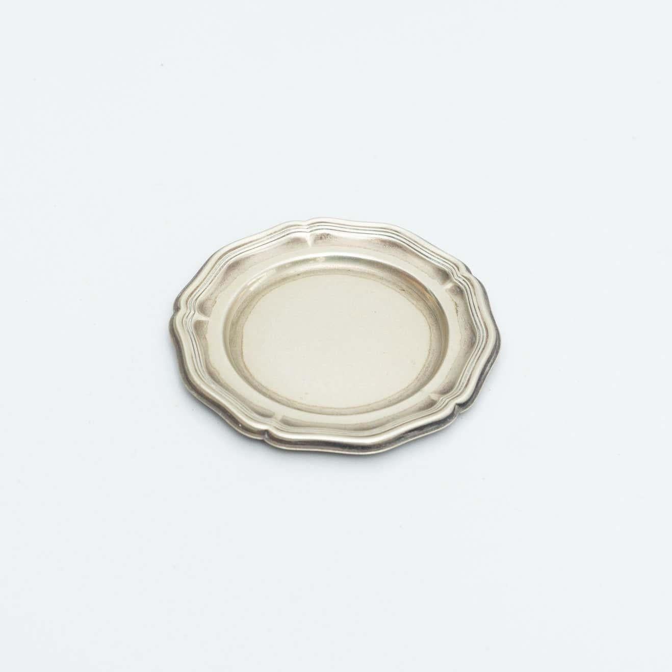 Metal ashtray by unknown manufactured from France, circa early 20th century.

In original condition, with minor wear consistent with age and use, preserving a beautiful patina.

Material:
Metal

Dimensions:
Ø 12 cm x H 0.7 cm.
