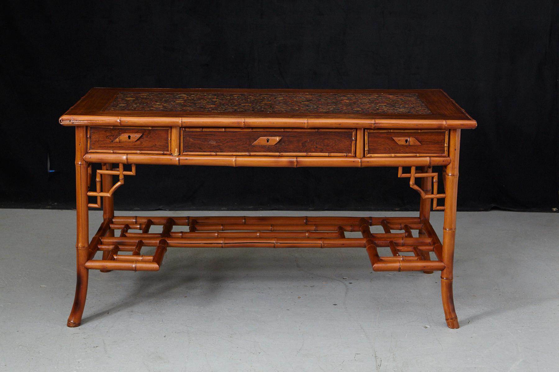 Early 20th century French bamboo desk with wooden lacquered top and leather inset
and three drawers and a low integrate shelf, circa 1920s.
The table is in a very good vintage condition, there are some cracks in the bamboo, which doesn't have any