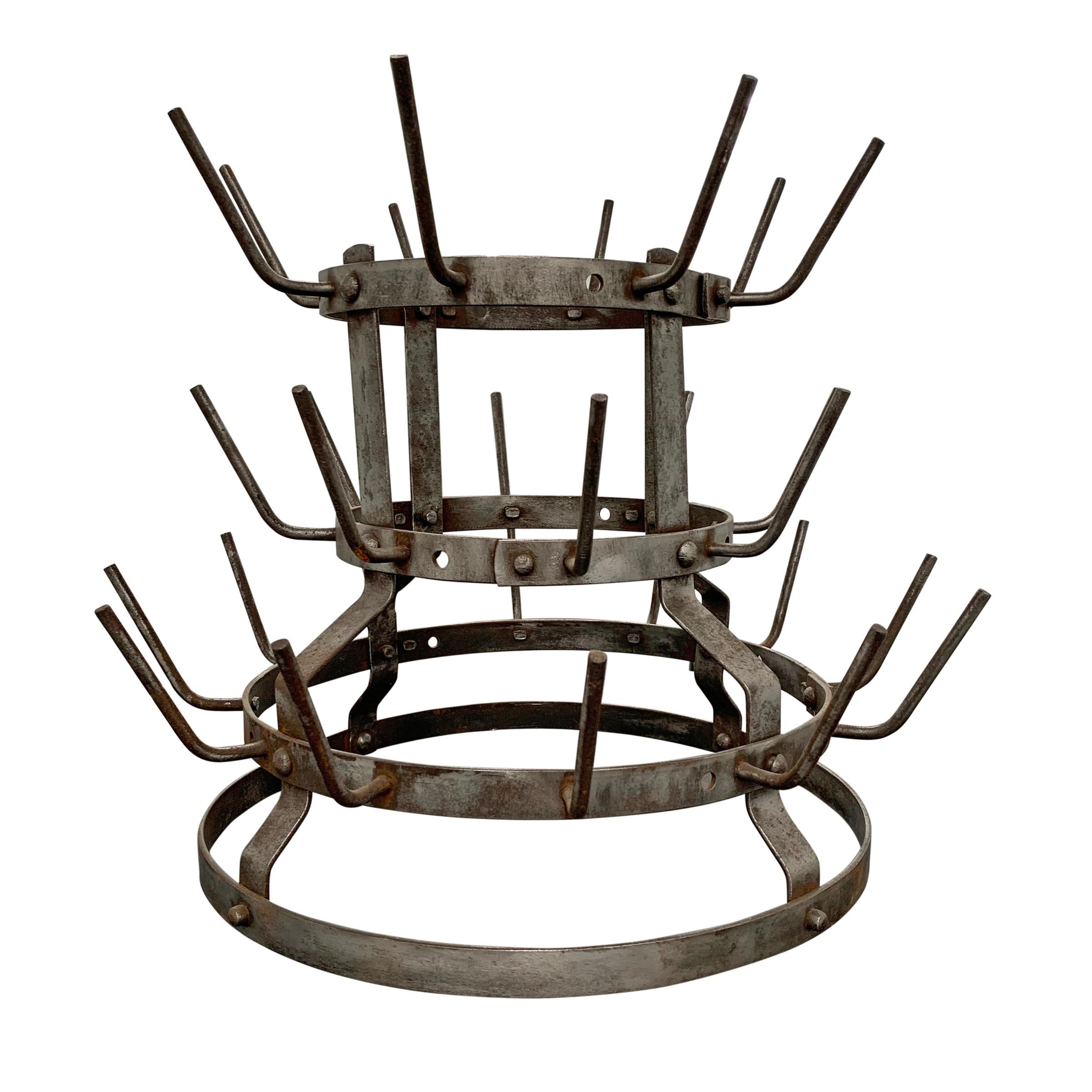 Early 20th century French bottle drying rack with three tiers. Racks like this were used in vineyards to dry used wine bottles.