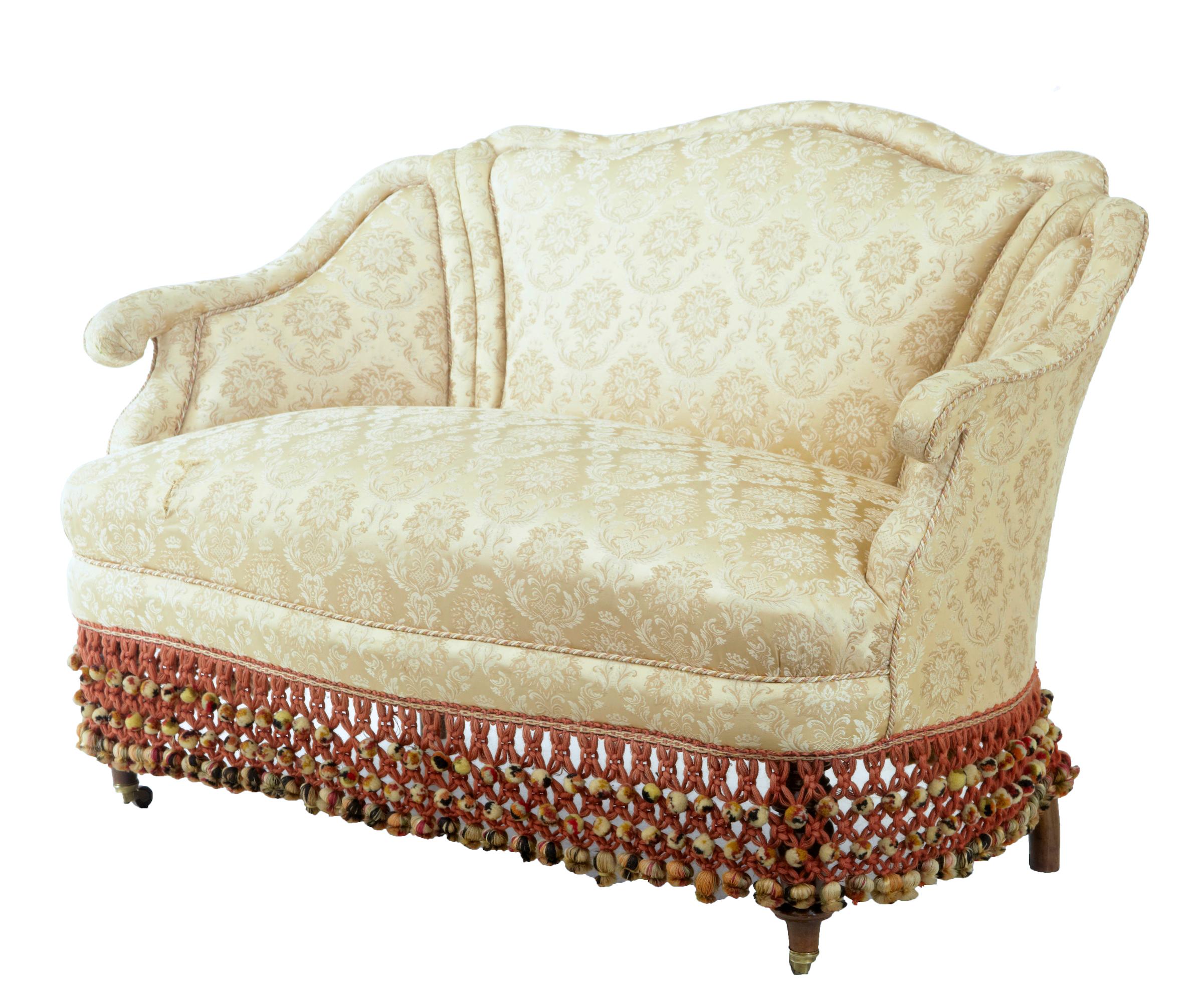 Early 20th century French boudoire small bedroom sofa circa 1920.

Boudoire small shaped bedroom sofa. Shaped arms and back offering comfort for 2 people. Currently covered in a satin floral fabric and complementary piping and contrasting border