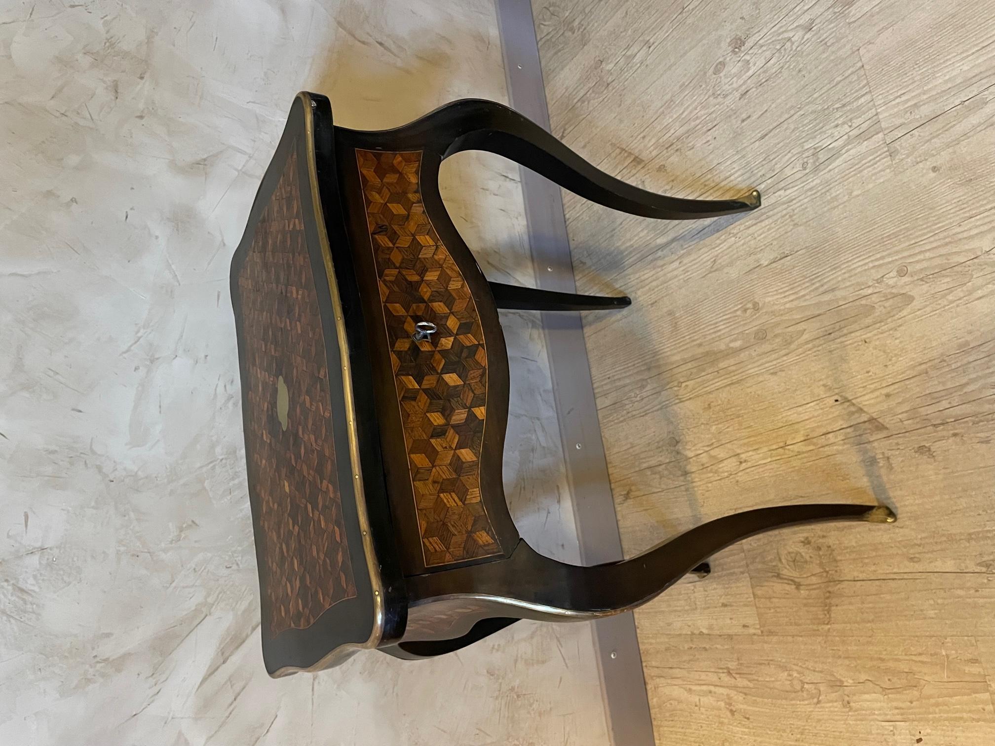 Louis XV style Beautiful and rare table from the early 20th century made with a checkerboard marquetry and brass. 
Opening top offering a beveled mirror and some compartment storage. 
Also a drawer with a key.
Very nice quality and condition.