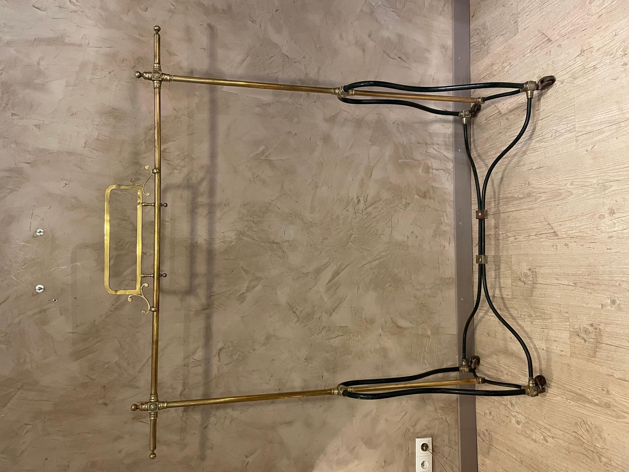 Exceptionnal early 20th century French Hotel rolling coat hanger made with gilded brass and metal. 
Four wheels. Entirely dismantable. Art Nouveau period.
Stamp of the hotel P.Lauzur rue Saint Denis Paris. 
Beautiful quality and condition.