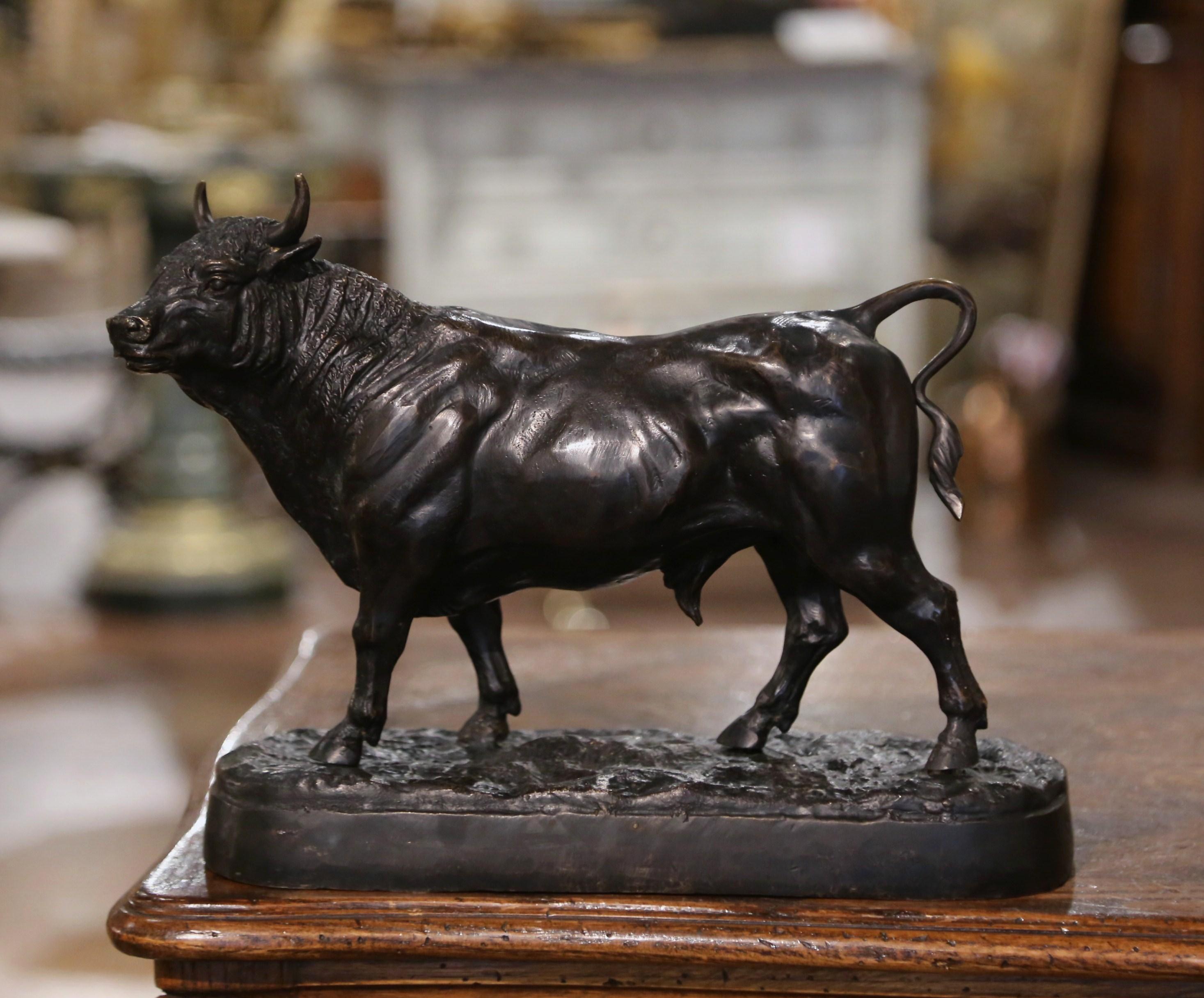 This antique bull sculpture was created in France, circa 1920. Set on a comforming oval base, the patinated bronze features a standing bovine in the manner of Isidore Bonheur. The bull sculpture is in excellent condition and adorns a rich patinated
