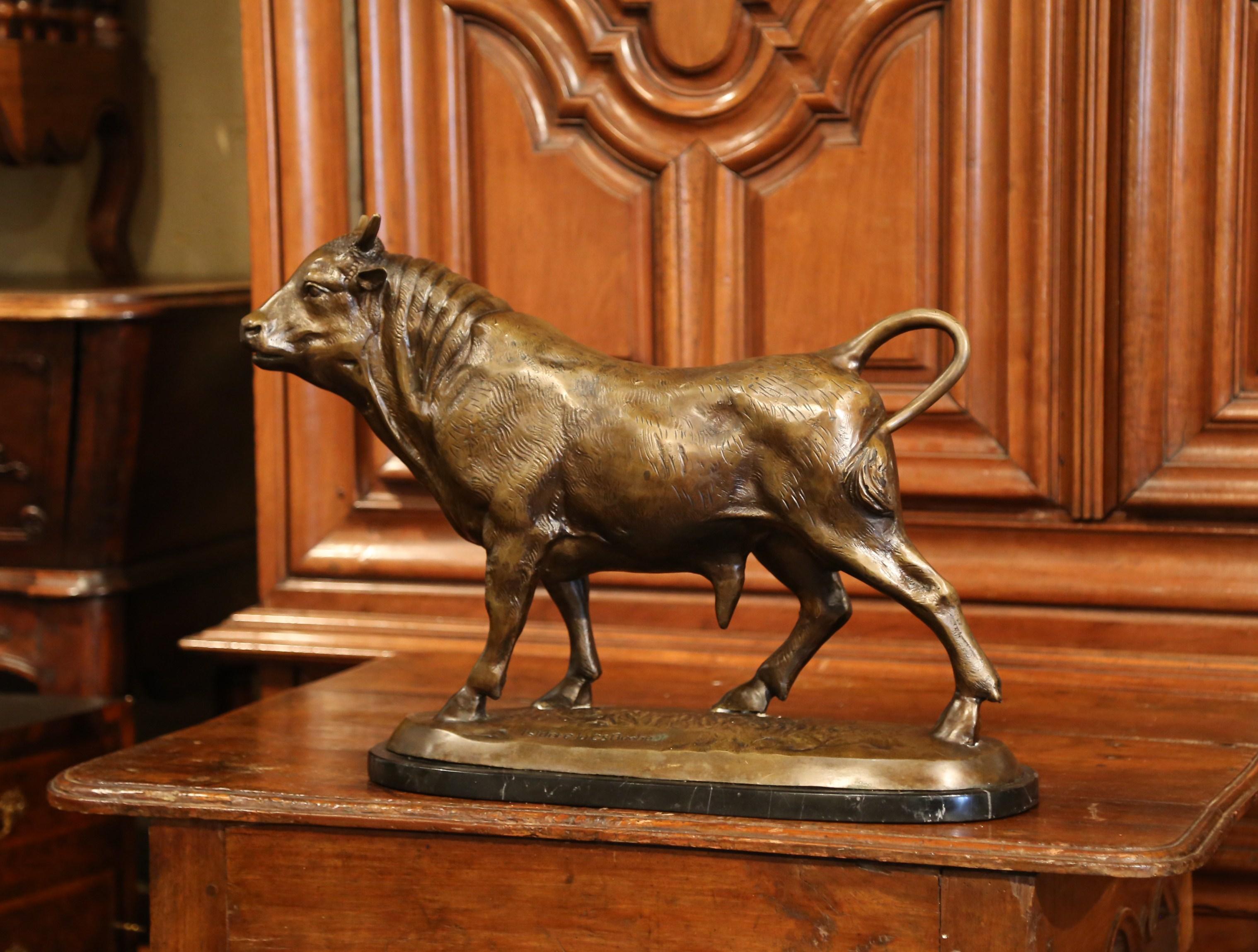 This antique bull sculpture was created in France, circa 1920. Set on a black marble base, the patinated bronze features a standing bovine with intricate details. The piece is signed on the base Isidore Jules Bonheur. Excellent condition with rich