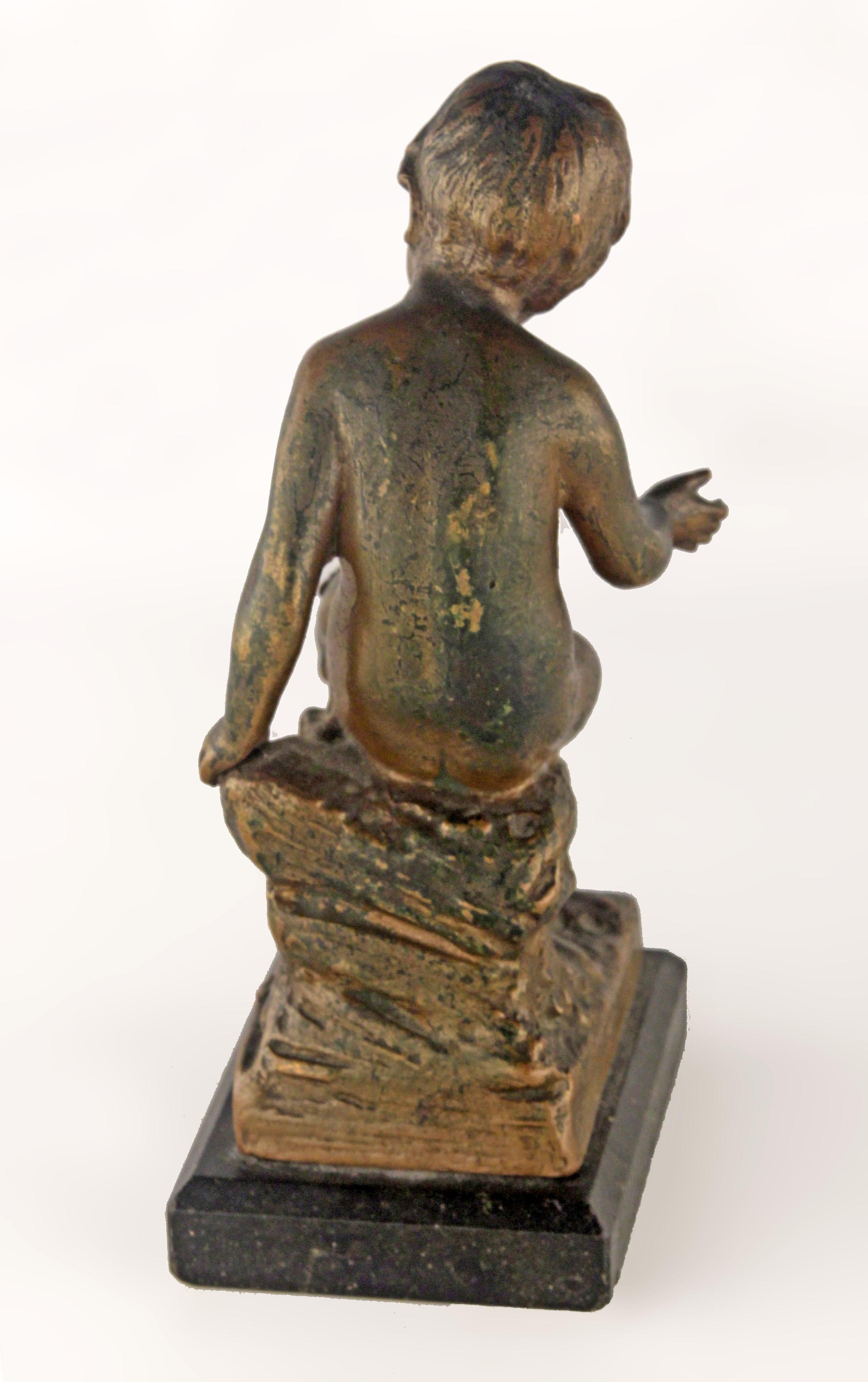 Cast Early 20th Century French Bronze Sculpture with Marble Base of a Sitting Boy For Sale