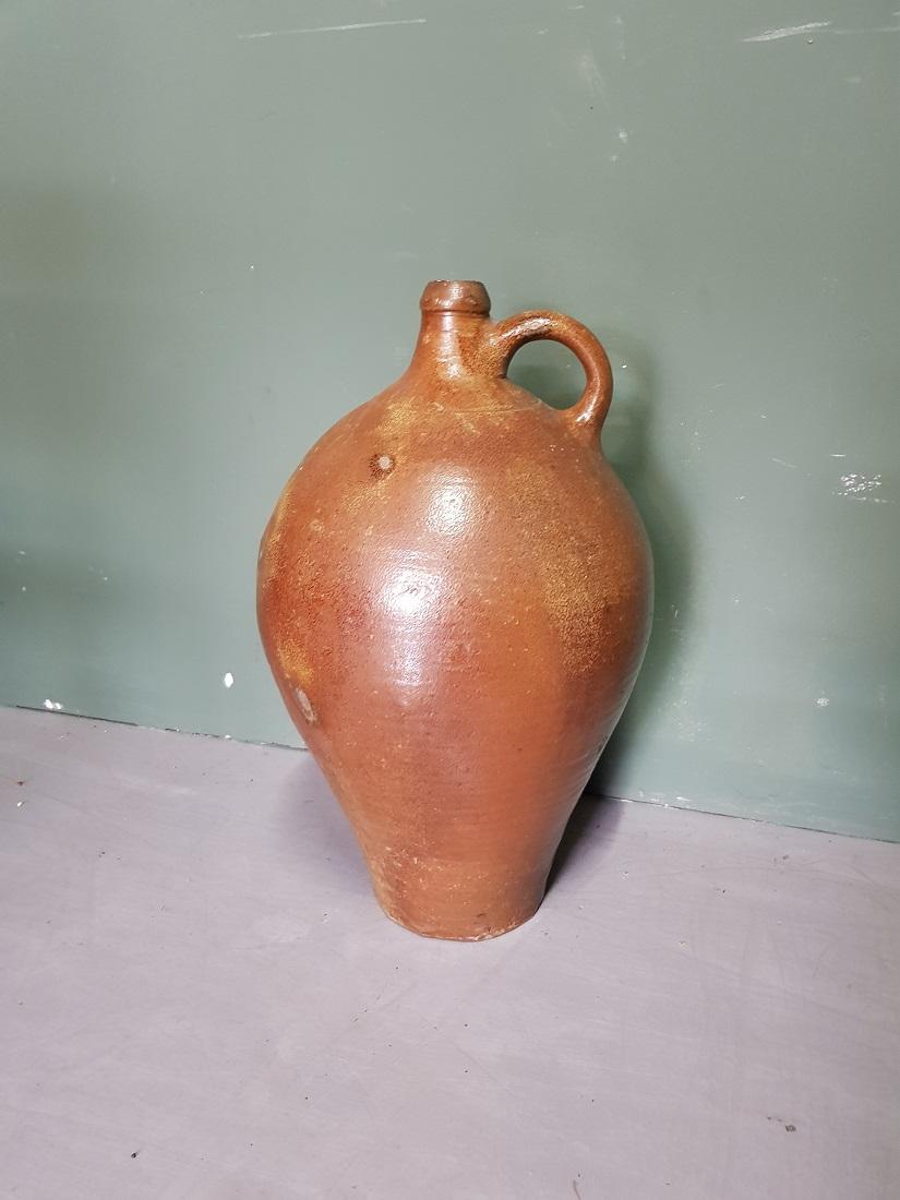 Old French brown glazed earthenware jug with ear and is in good condition with light user marks, early 20th century.

The measurements are:
Depth 30 cm/ 11.8 inch.
Width 30 cm/ 11.8 inch.
Height 50 cm/ 19.6 inch.