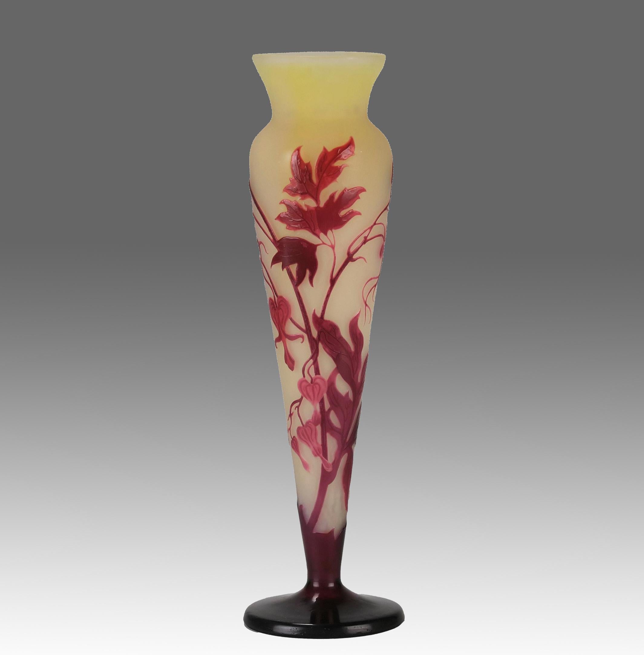 A very attractive early 20th Century French cameo glass slender shaped vase decroated with deep burgundy and red flowers against a vibrant yellow field, signed Gallé.

ADDITIONAL INFORMATION
Height:                                        32