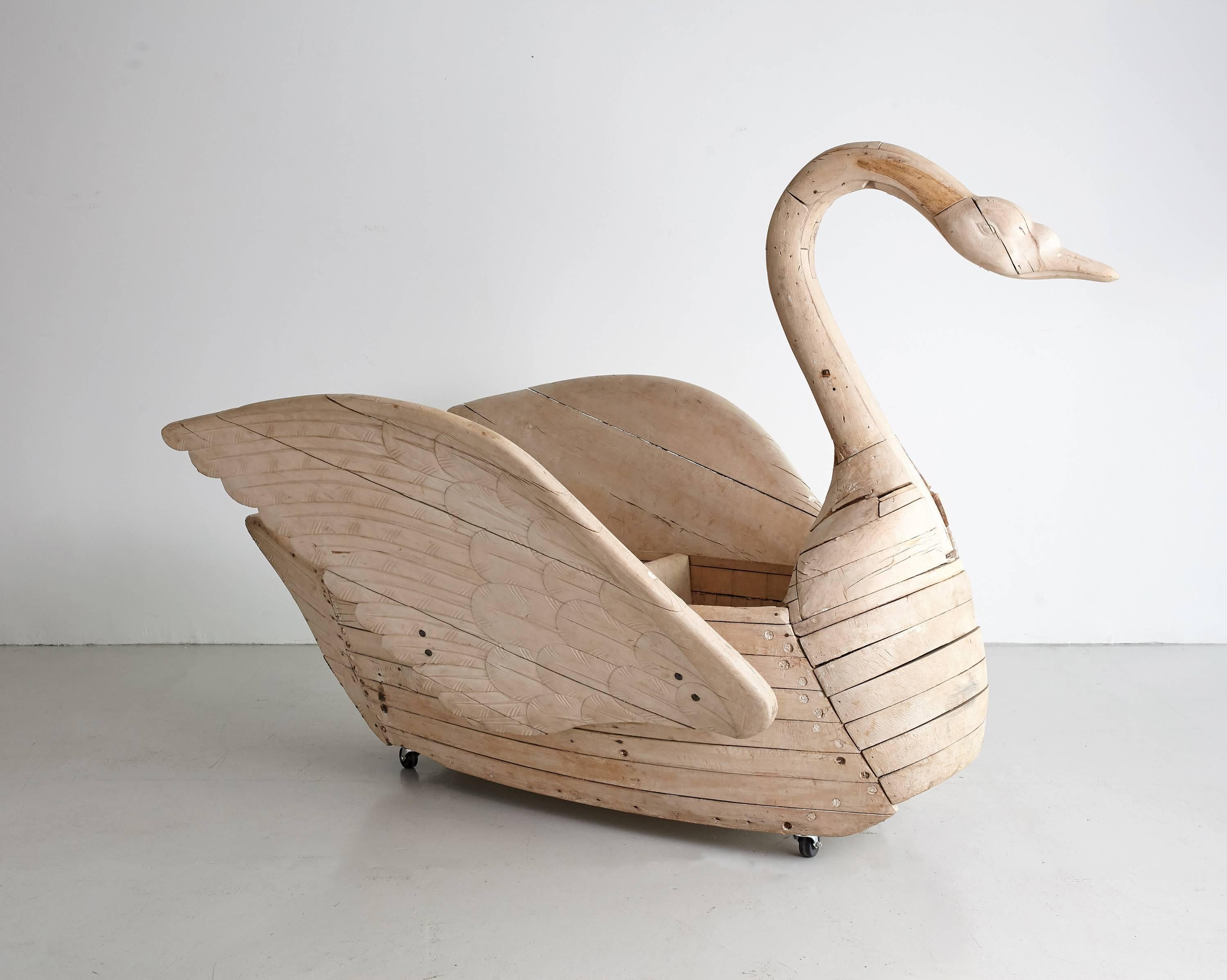Grand, whimsical hand-carved wooden swan seat from a French carousel, circa 1920. Perhaps the most elegant thing ever to land at the Orange Gallery! Beautiful in a nursery or outdoor in a play area. Incredible one-of-a-kind piece. 

 
