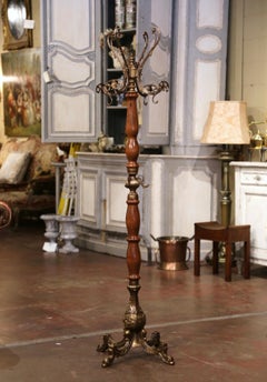 Early 20th Century French Carved Elm and Brass Swivel Dolphin Standing Hall Tree