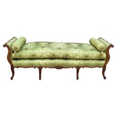 Early 20th Century French Carved Fruitwood Daybed in Green Silk