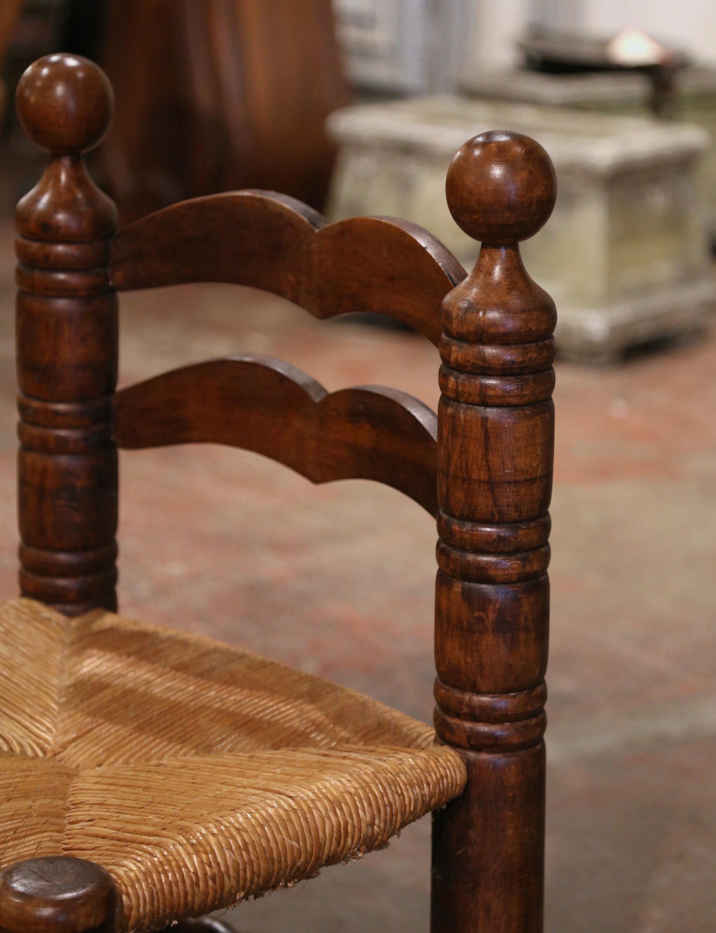 Hand-Carved Early 20th Century French Carved Oak and Rush Seat Low Fireplace Armchair  For Sale