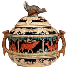 Early 20th Century French Carved Painted Ceramic Soup Tureen with Hunt Motifs