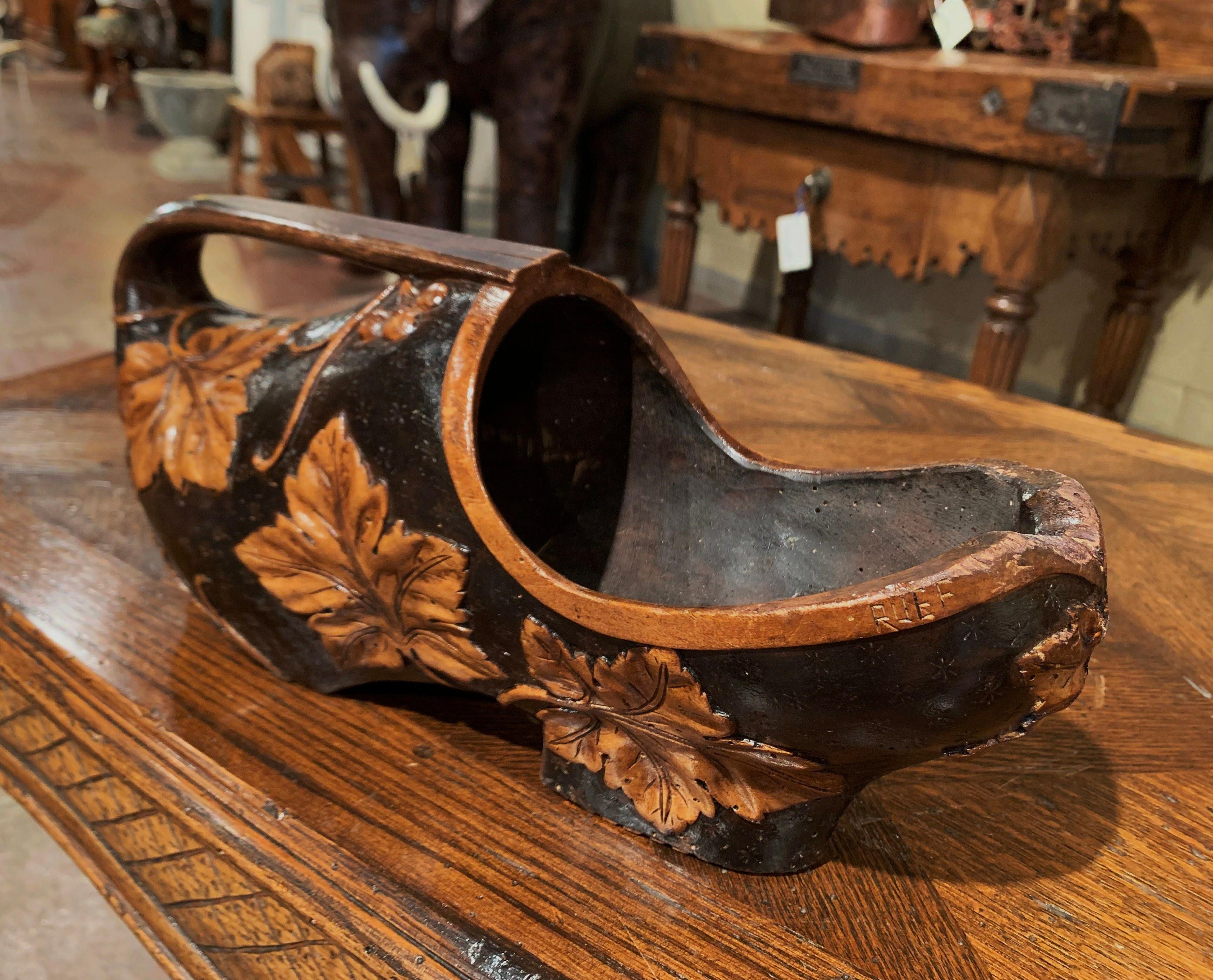Black Forest Early 20th Century French Carved Walnut Wine Bottle Holder Clog with Vine Decor For Sale