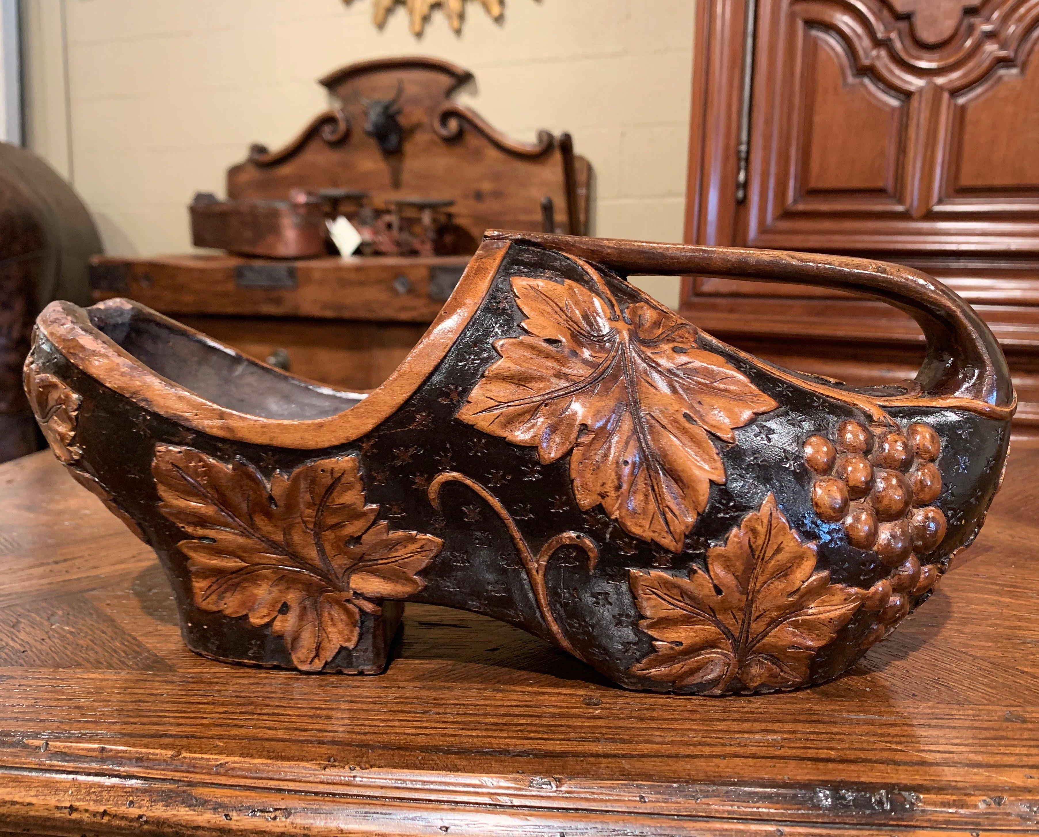 Patinated Early 20th Century French Carved Walnut Wine Bottle Holder Clog with Vine Decor For Sale