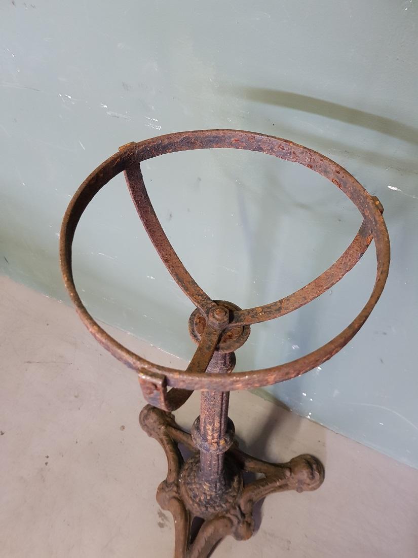 Antique French cast iron stand with half-spherical holder, here used to be a tin ashtray holder and stood on the terrace, furthermore in good condition but weathered. Originating from circa 1900.

The measurements are,
Depth 43 cm/ 16.9