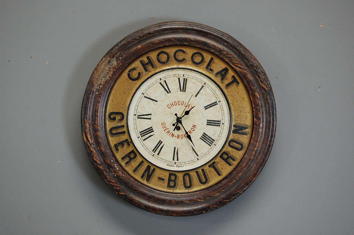 Chocolat advertising clock, tole with a replaced modern quartz movement. Expected wear and patina, France, circa 1930.
   