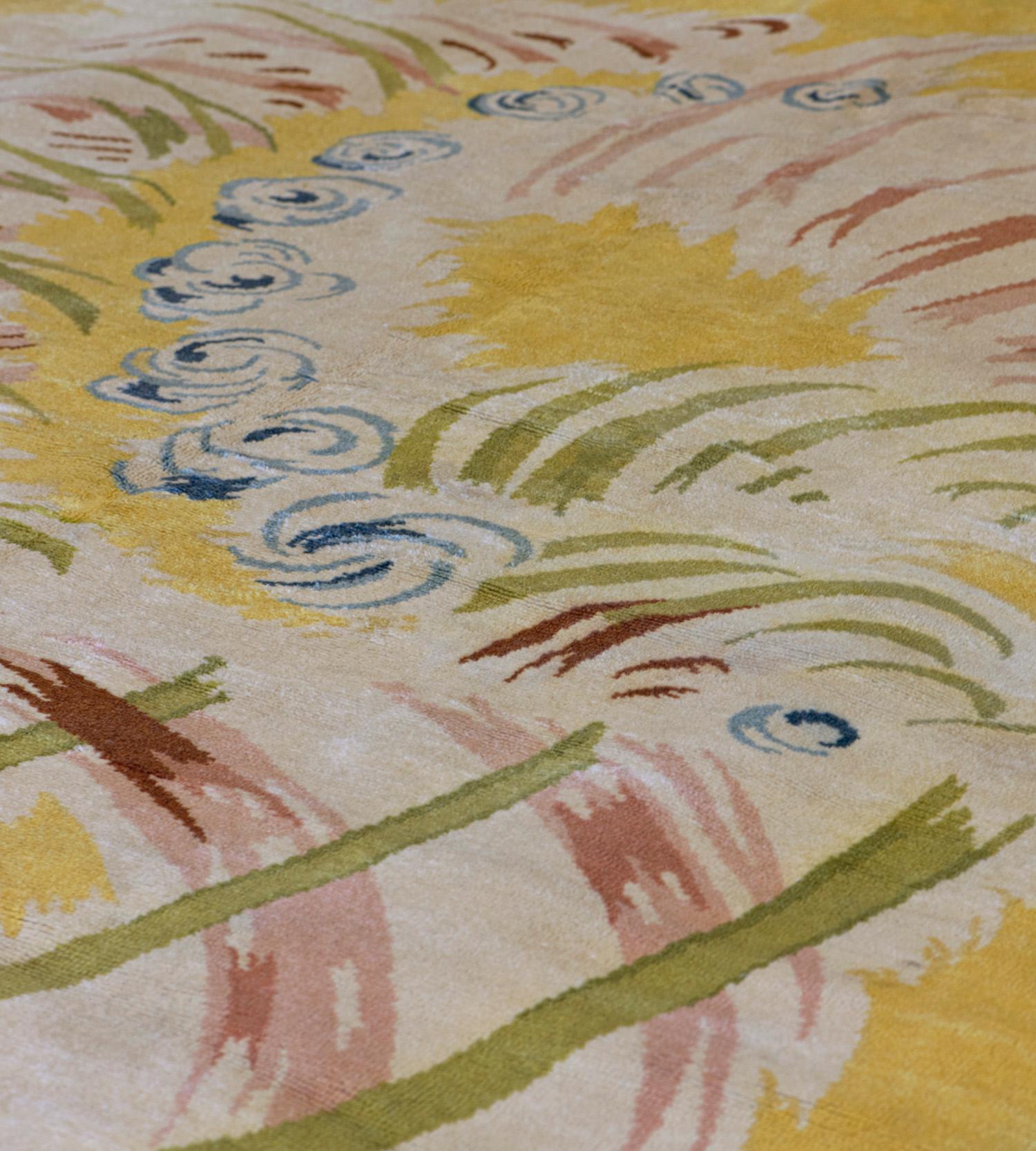 This traditional handwoven French deco rug has an ivory field with broad sweeping strokes suggesting clouds and abstract motif, in a loose golden saffron border. 

In the rug trade, the term “Deco” applies to European and some Chinese rugs that