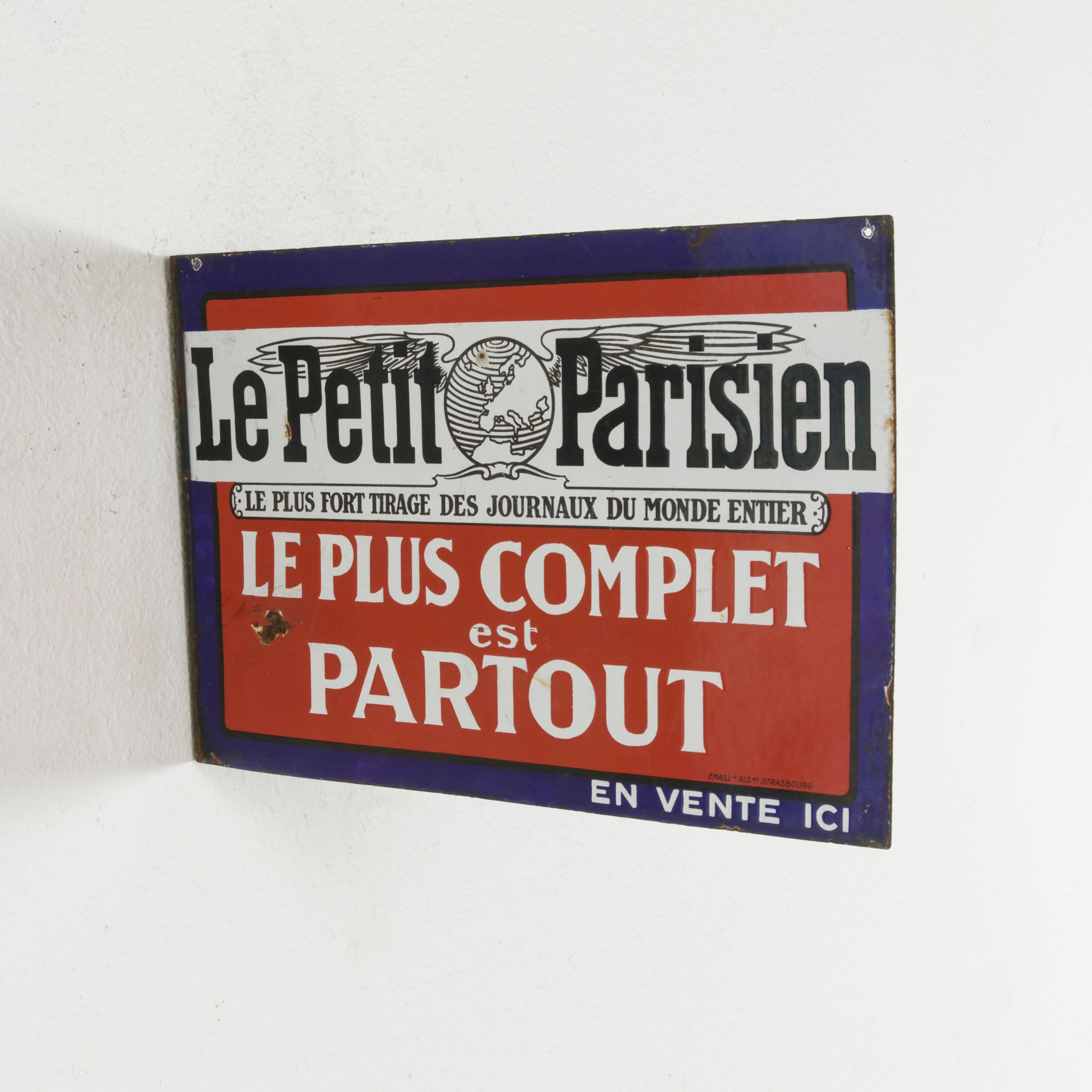 This early 20th century French enameled metal sign is double faced and features publicity for the newspaper Le Petit Parisien. The most prominent French newspaper of the Third Republic with publish dates between 1876 and 1944, its circulation was