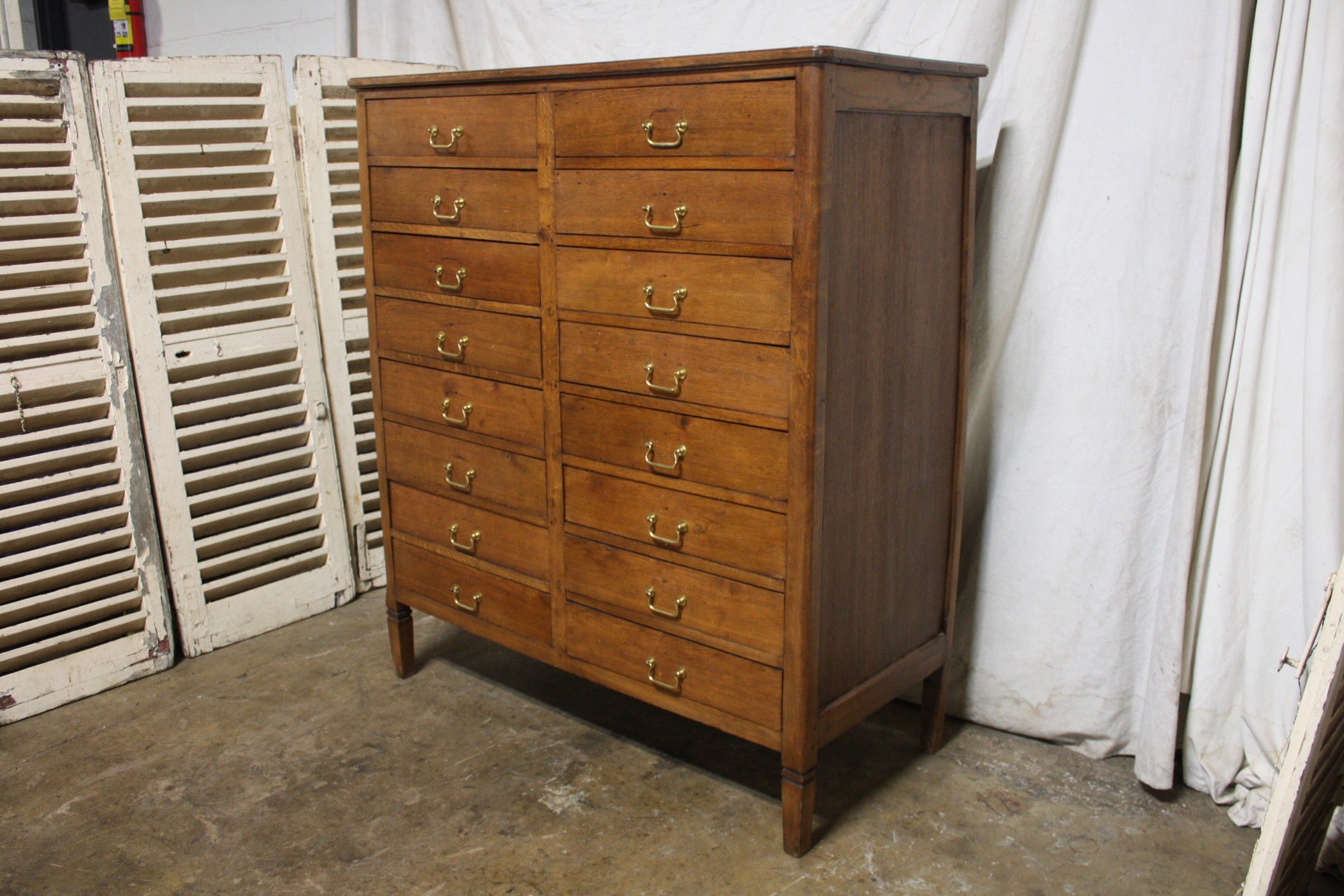 Early 20th century French dresser with 16 drawers.