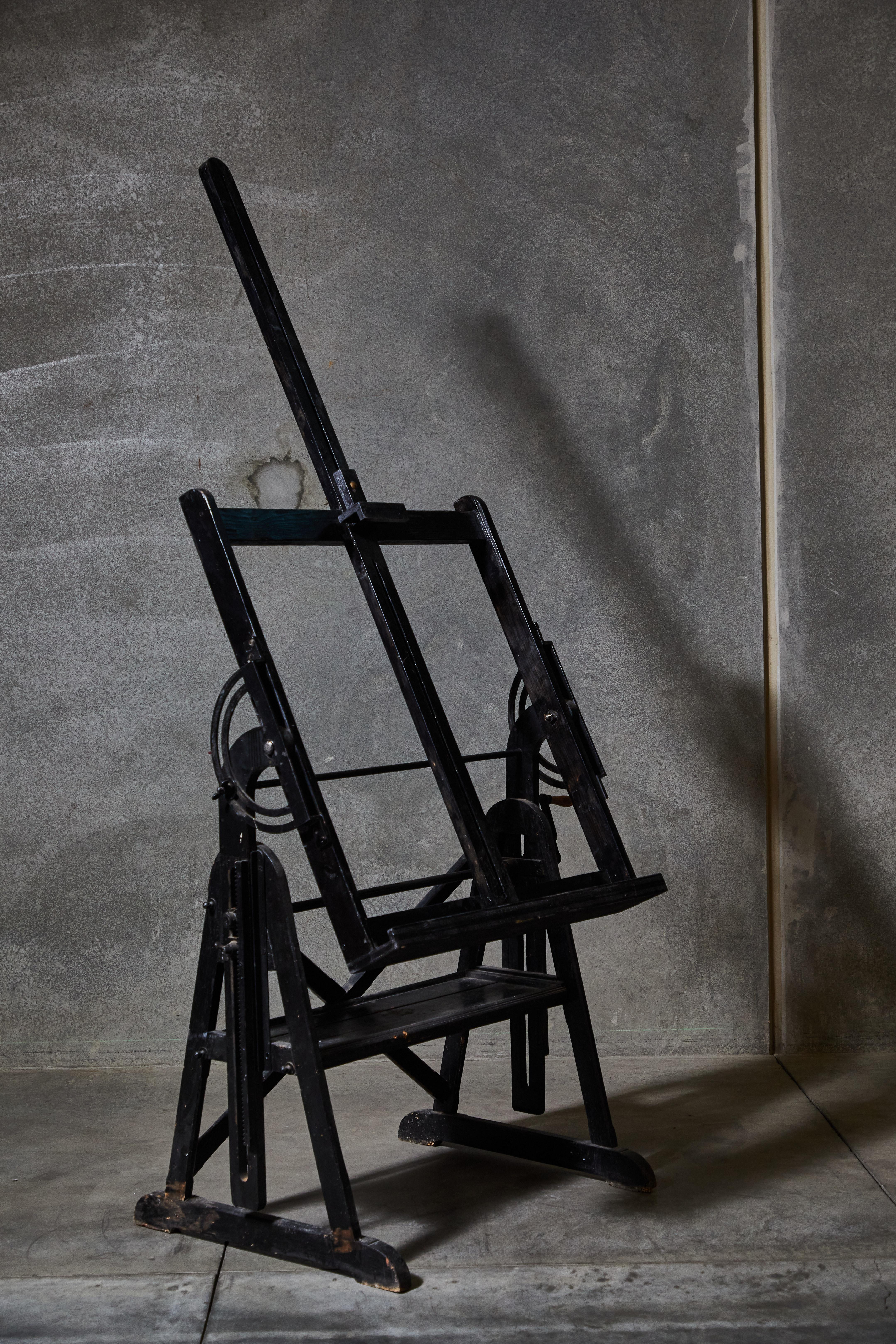 Large adjustable artist's easel with original iron hardware. Made in France circa 1900s.