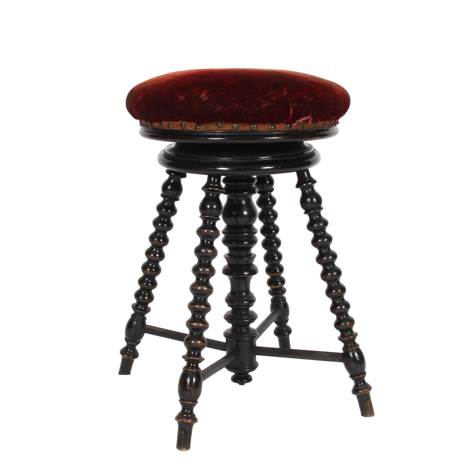 French, 1900

A charming ebonised wood, and upholstered, swivel 'Bobbin' stool with red velvet seat.

Adjustable height.