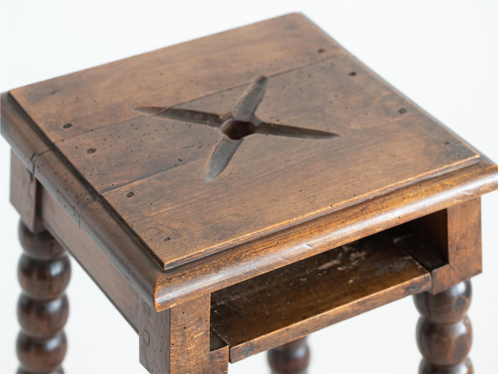 An ecclesiastical bobbin stool with recessed hymn book shelf. French, early 20C.

Stock ref. #2210

In good sturdy order. Some evidence of historic worm all treated as a precautionary and preventative measure.

69 x 37 x 37 cm (27.2 x 14.6 x 14.6
