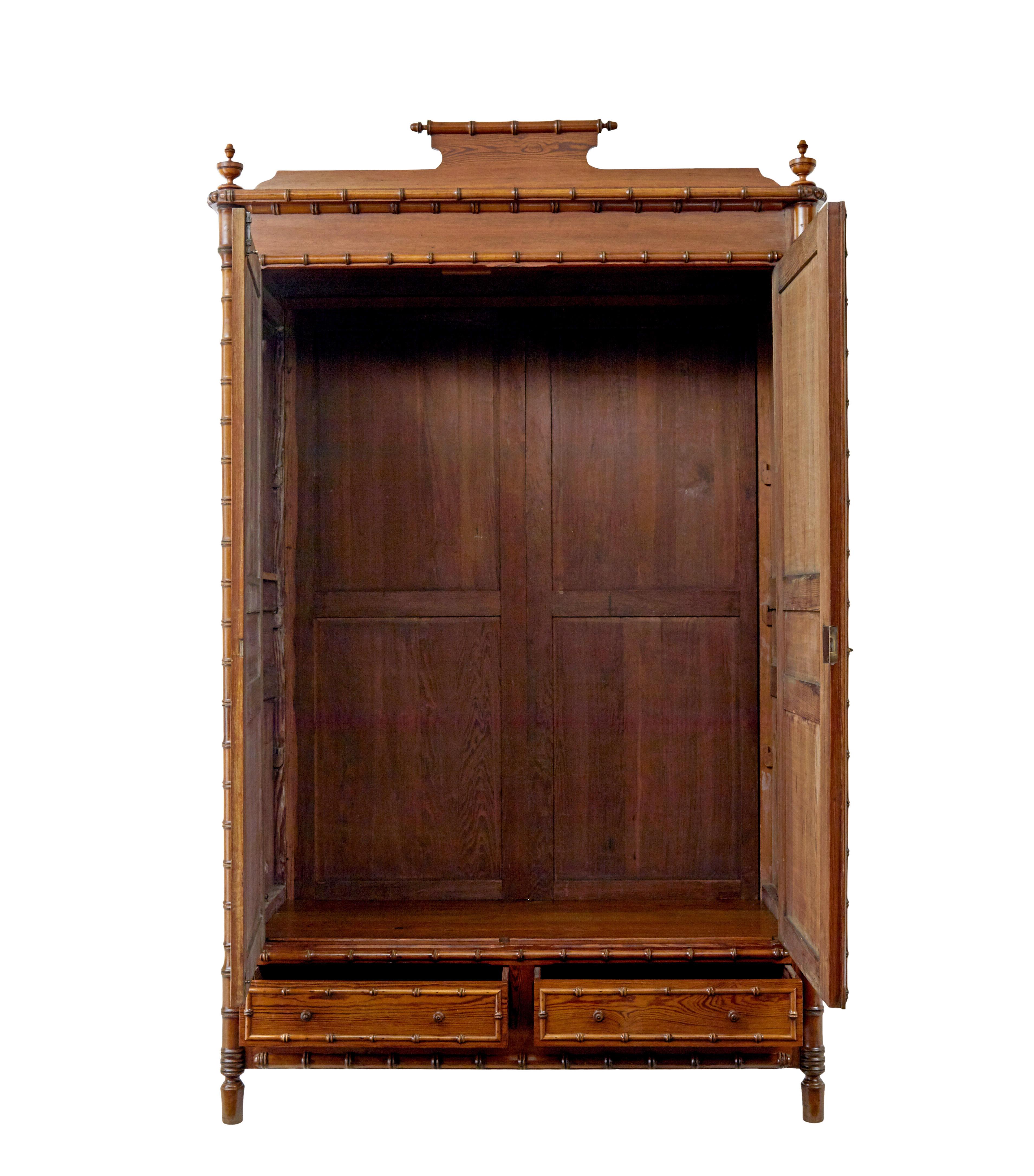 Early 20th century french faux bamboo pine wardrobe circa 1900.

Beautiful quality pitch pine french wardrobe which has just been fully re-furbished by hand in our workshop.

Over-sailing top decorated with cornice and turned finials, double doors