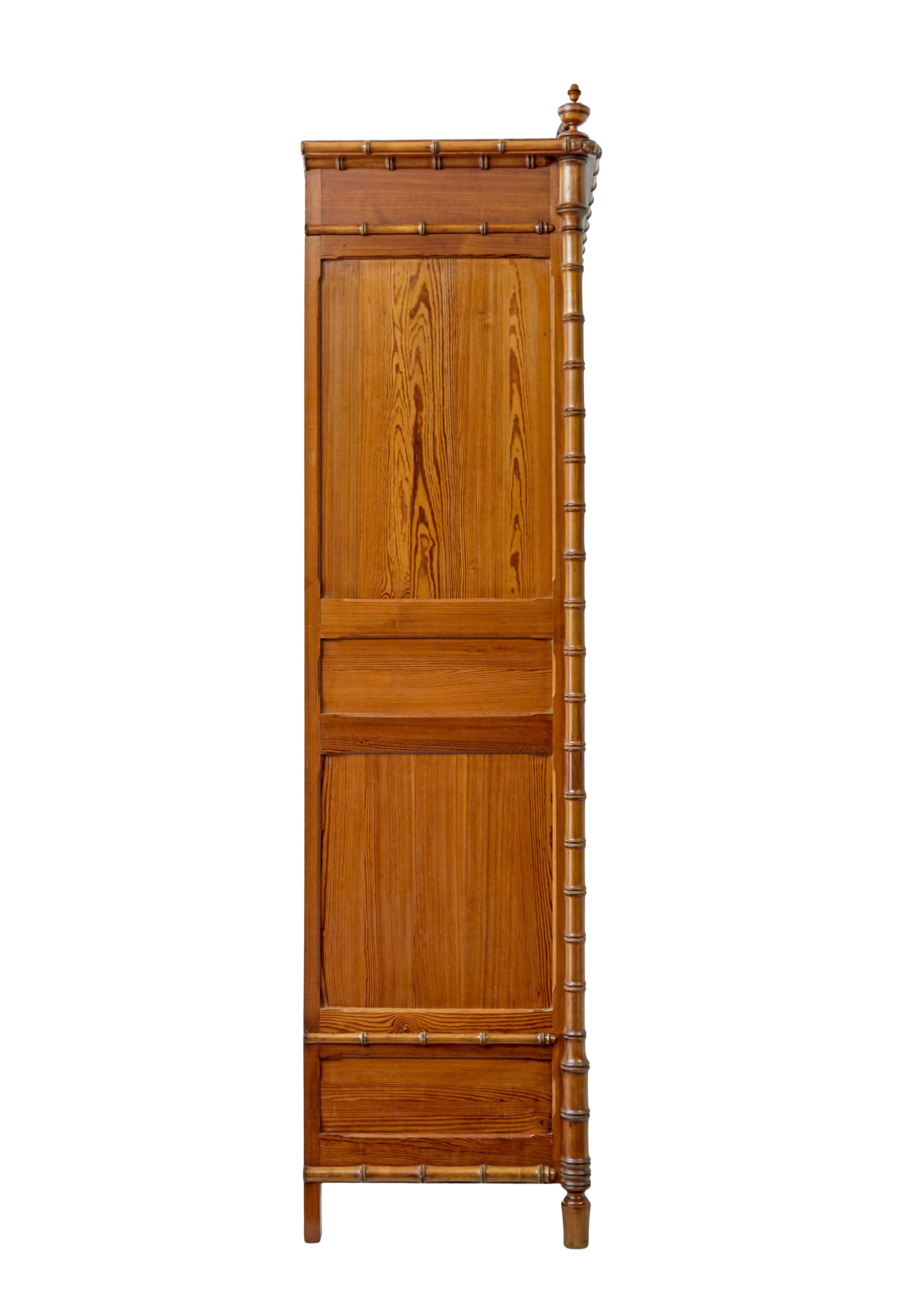 Carved Early 20th century French faux bamboo pine wardrobe