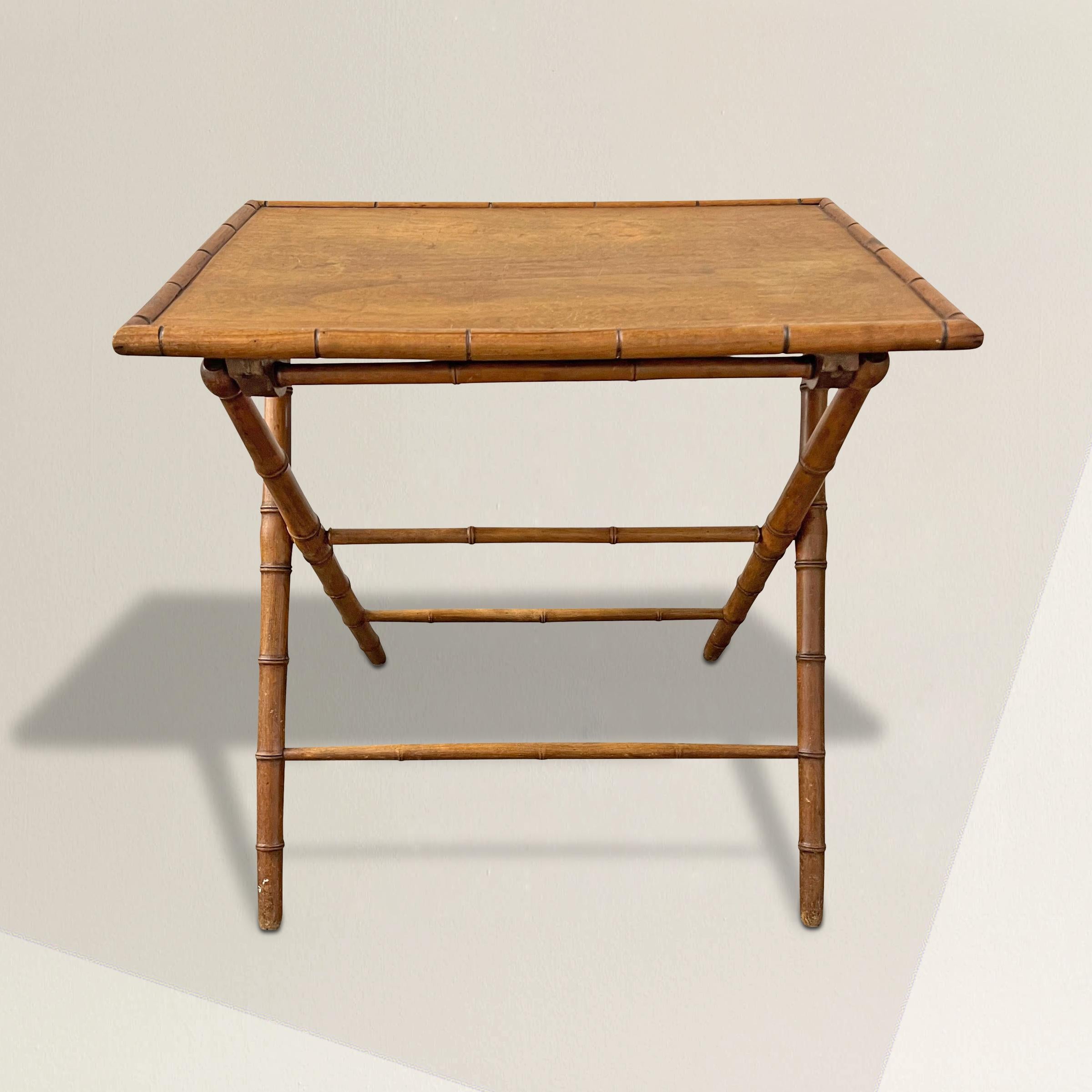 A charing early 20th century French folding cafe table carved of maple and meant to mimic bamboo. Originally used in a cafe, the table is now the perfect side table, night stand, or occasional table that you can tuck away when I not in use.