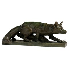 Scultura francese di una volpe in terracotta color verde bosco, dei primi anni del XX secolo, opera di Henri Bargas