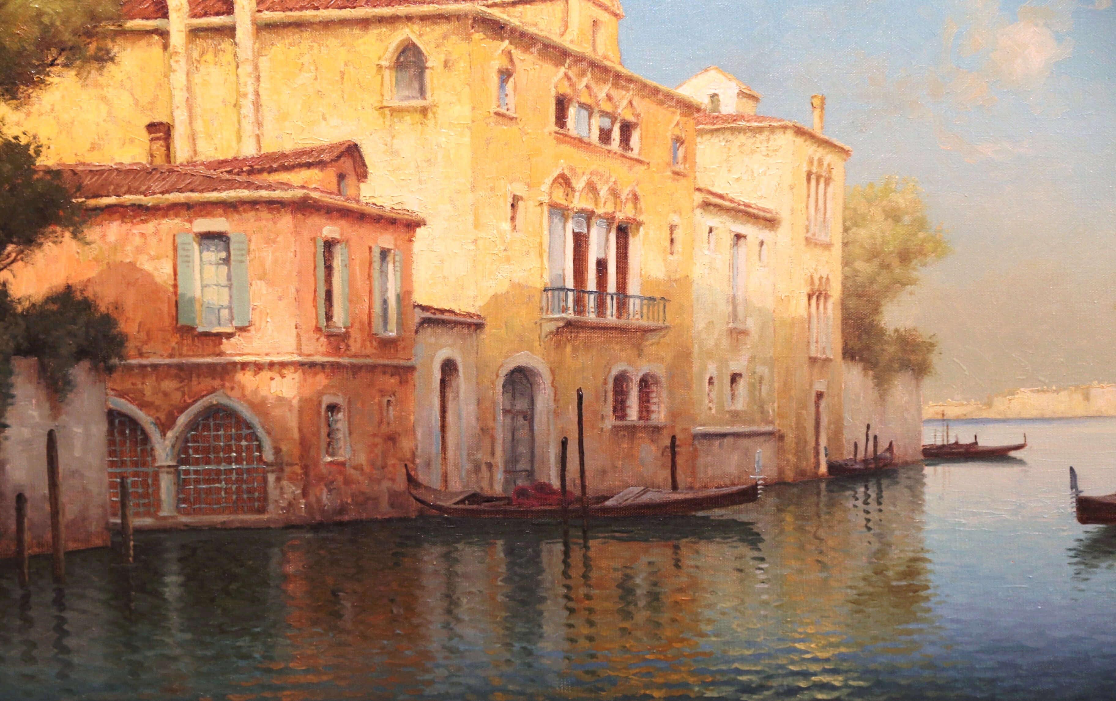 Decorate a den or living room with this elegant antique painting. Created in France circa 1910, and set in the original carved frame, the large and colorful canvas features the grand canal in Venice. The art work depicts a sunset on the canal with