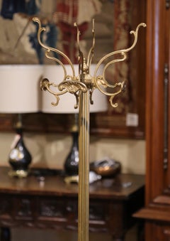 Early 20th Century French Gilt Brass Swivel Four-Hook Standing Figural Hall Tree