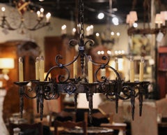 Early 20th Century French Gothic Polished Wrought Iron Eight-Light Chandelier