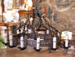 Early 20th Century French Gothic Twelve-Light Iron Chandelier with Gilt Accents