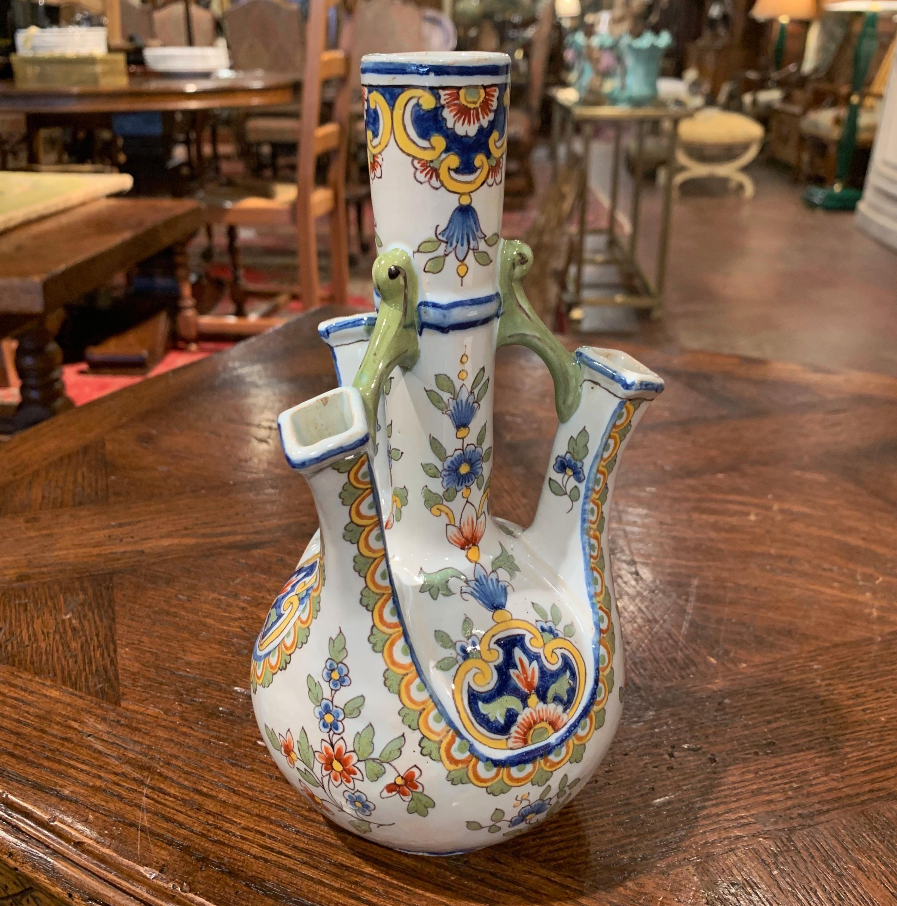 Place this interesting antique ceramic vase on a shelf or entry commode, crafted in Normandy, France, circa 1900, the Classic vase is round in shape and features four entrances for flowers including a larger one in the center. The vase is hand