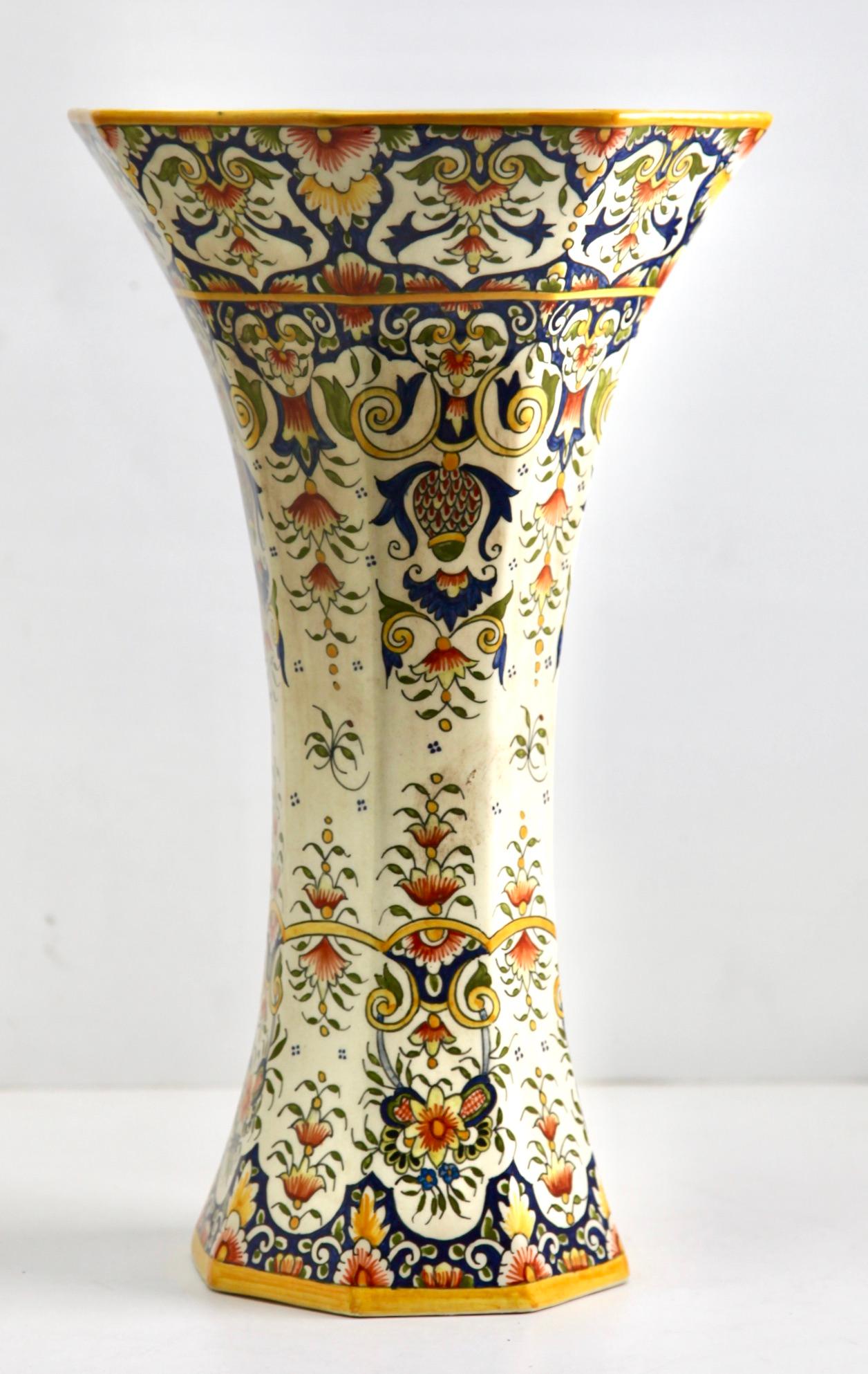 The designs on this French faience group is typical of pottery made in Rouen. 
Early 20th Century French Hand-Painted Faience Vasse from Rouen 
Marking on the bottom: 