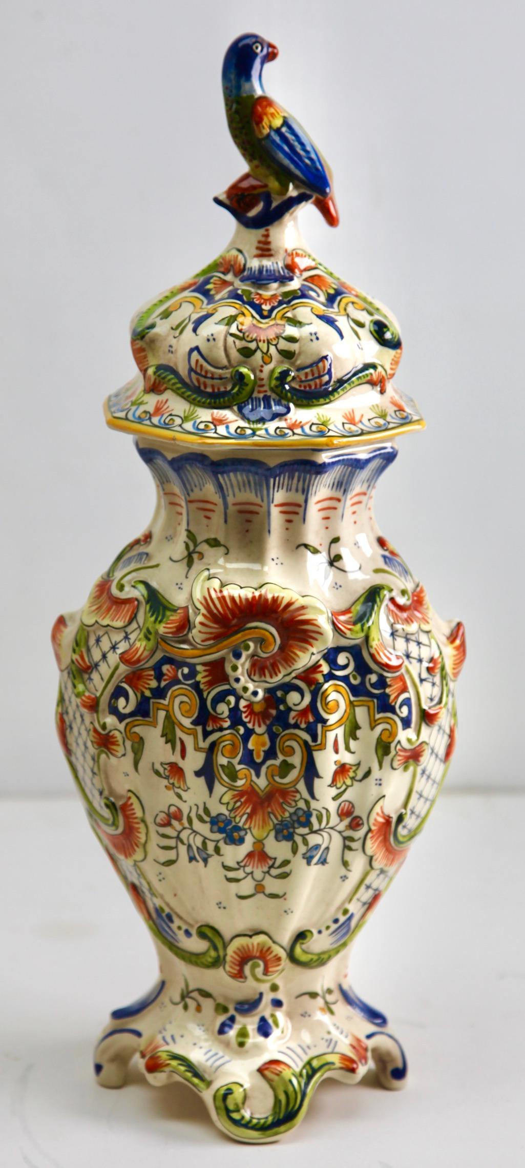 The designs on this French faience group is typical of pottery made in Rouen. 
Early 20th century French hand-painted Faience vasse from Rouen 
Marking on the bottom: 