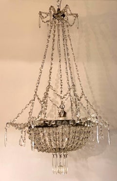 Early 20th Century French Iron and Crystal Chandelier.