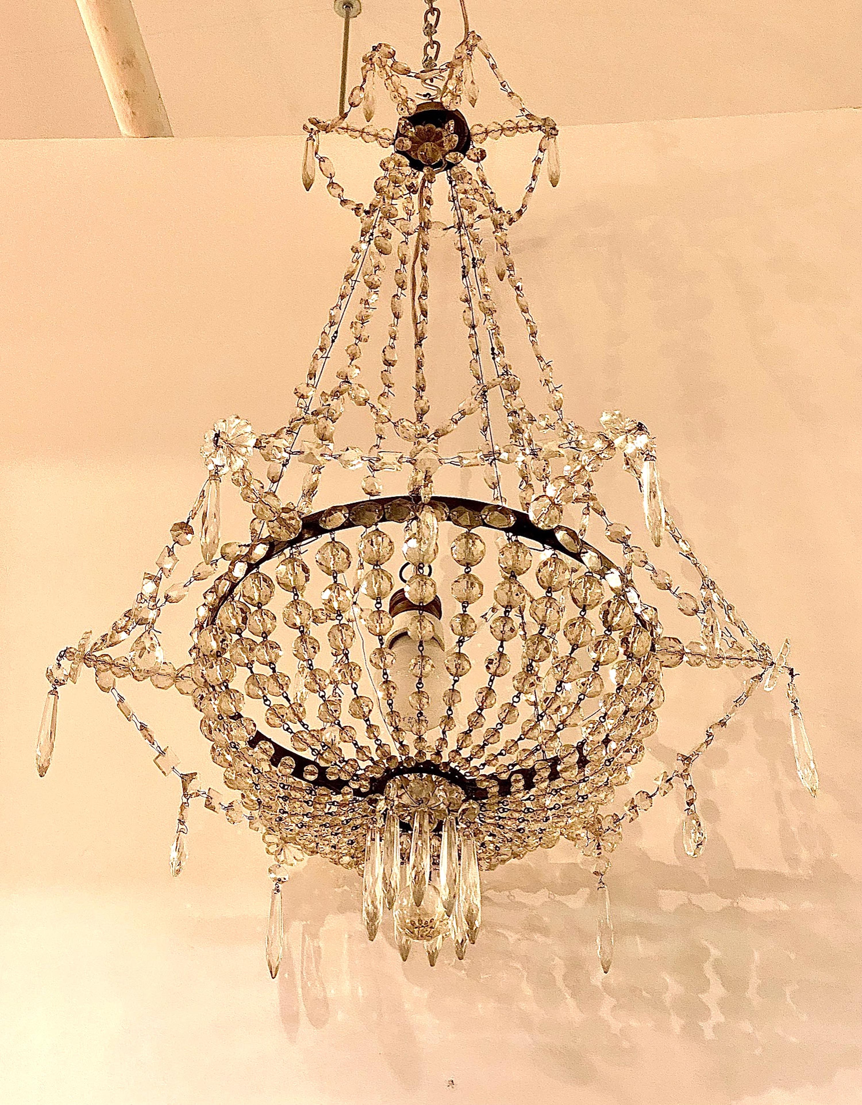 Neoclassical Early 20th Century French Iron and Crystal Chandelier. For Sale