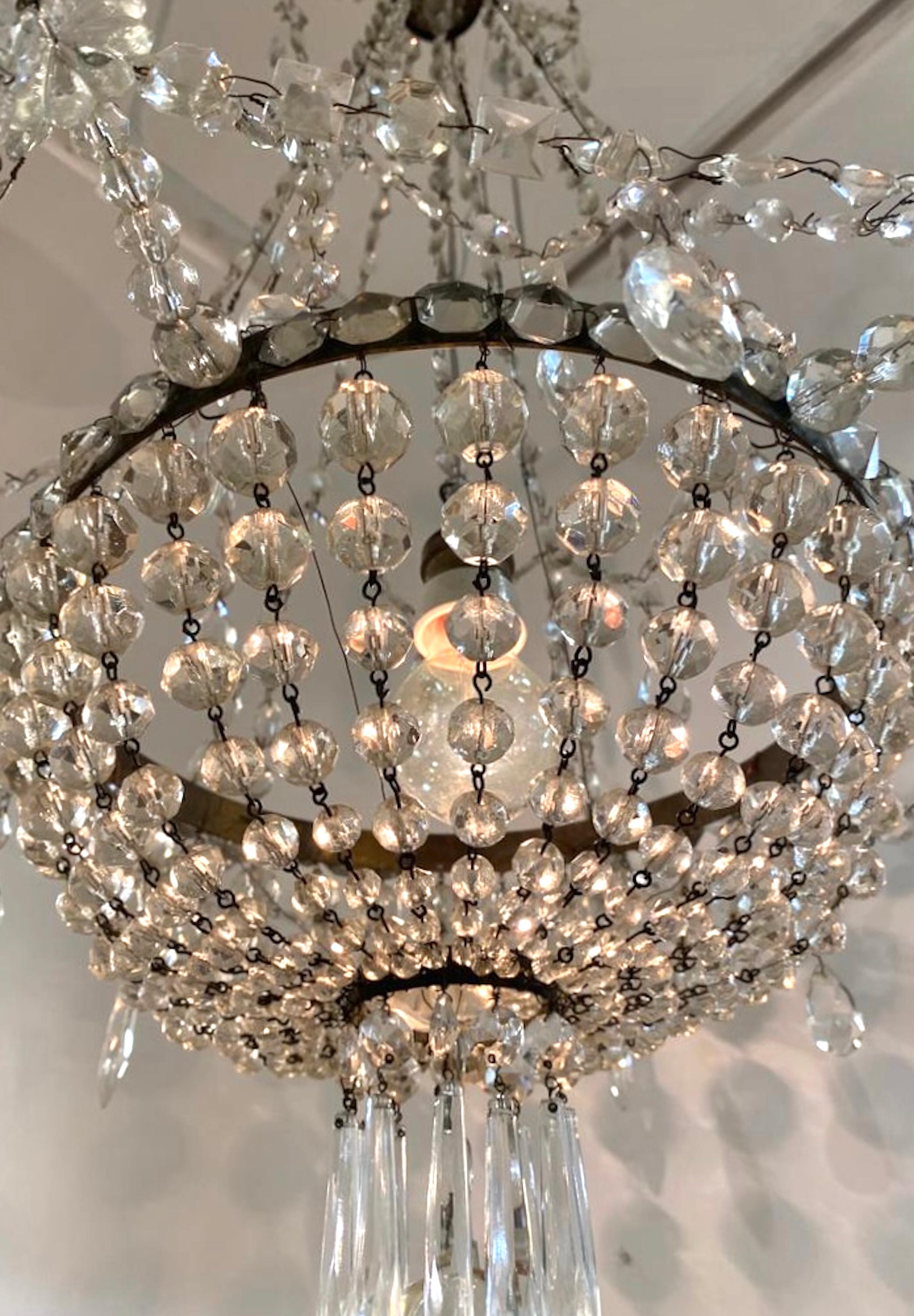 Early 20th Century French Iron and Crystal Chandelier. In Good Condition For Sale In New York, NY