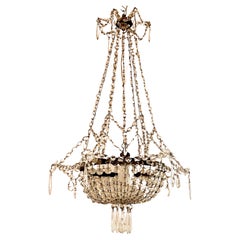 Early 20th Century French Iron and Crystal Chandelier.