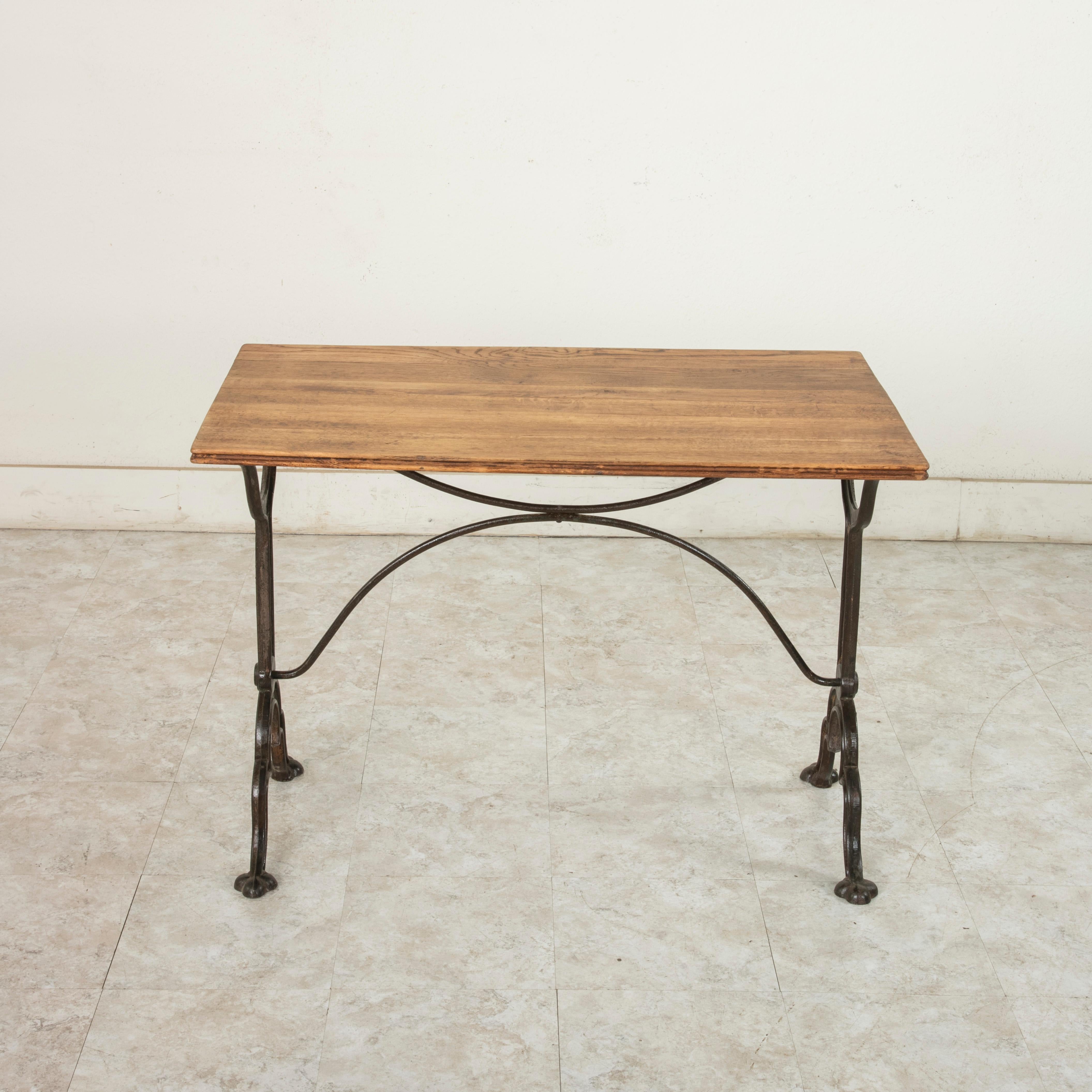 Cast Early 20th Century French Iron and Oak Bistro Table or Cafe Table