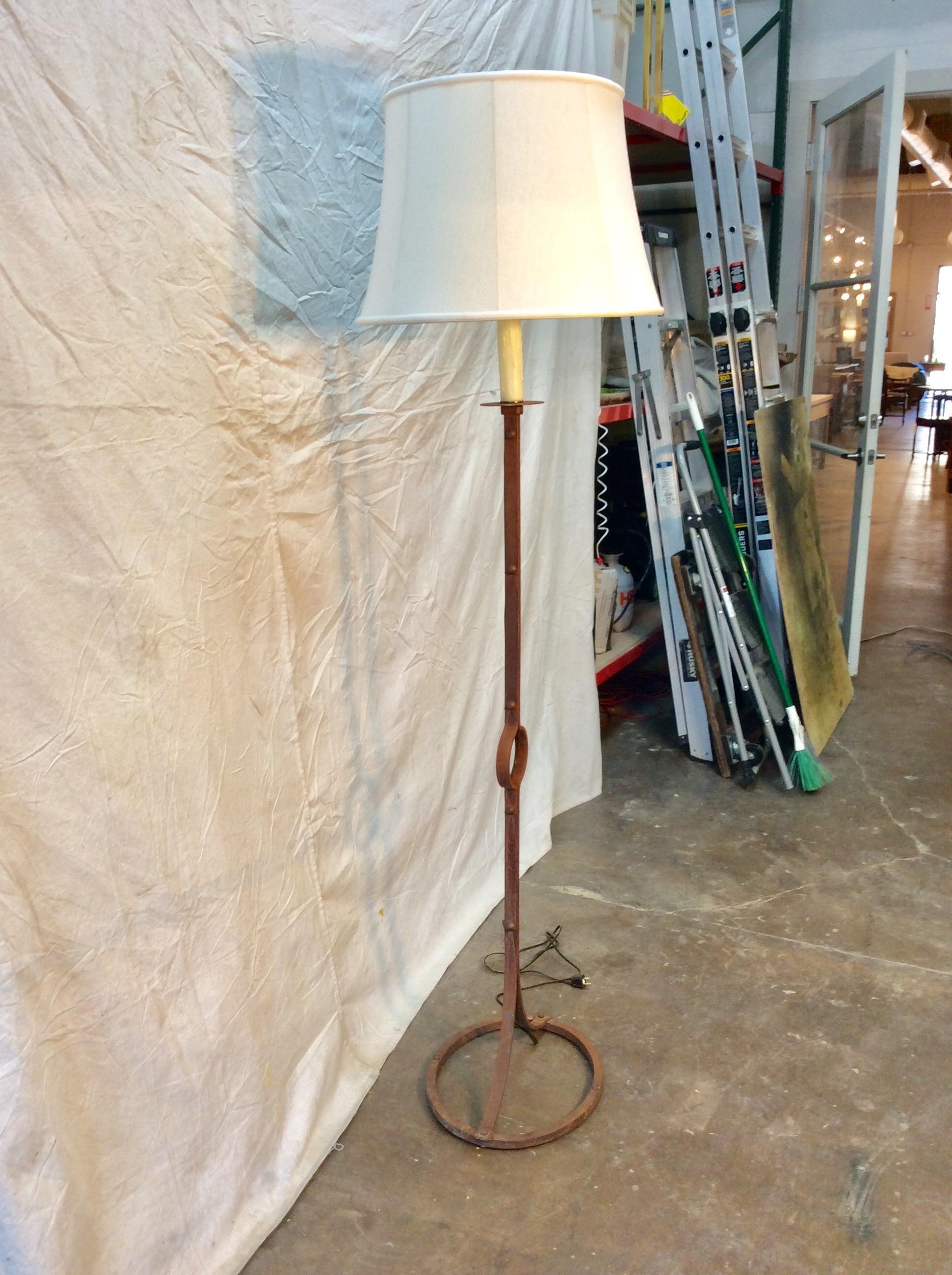 Found in the South of France, this Early 20th century French Iron Floor Lamp features a central sphere and rests on an iron oval. Simple and chic this piece would be at home in any decor.

Floor Lamp: 16.5