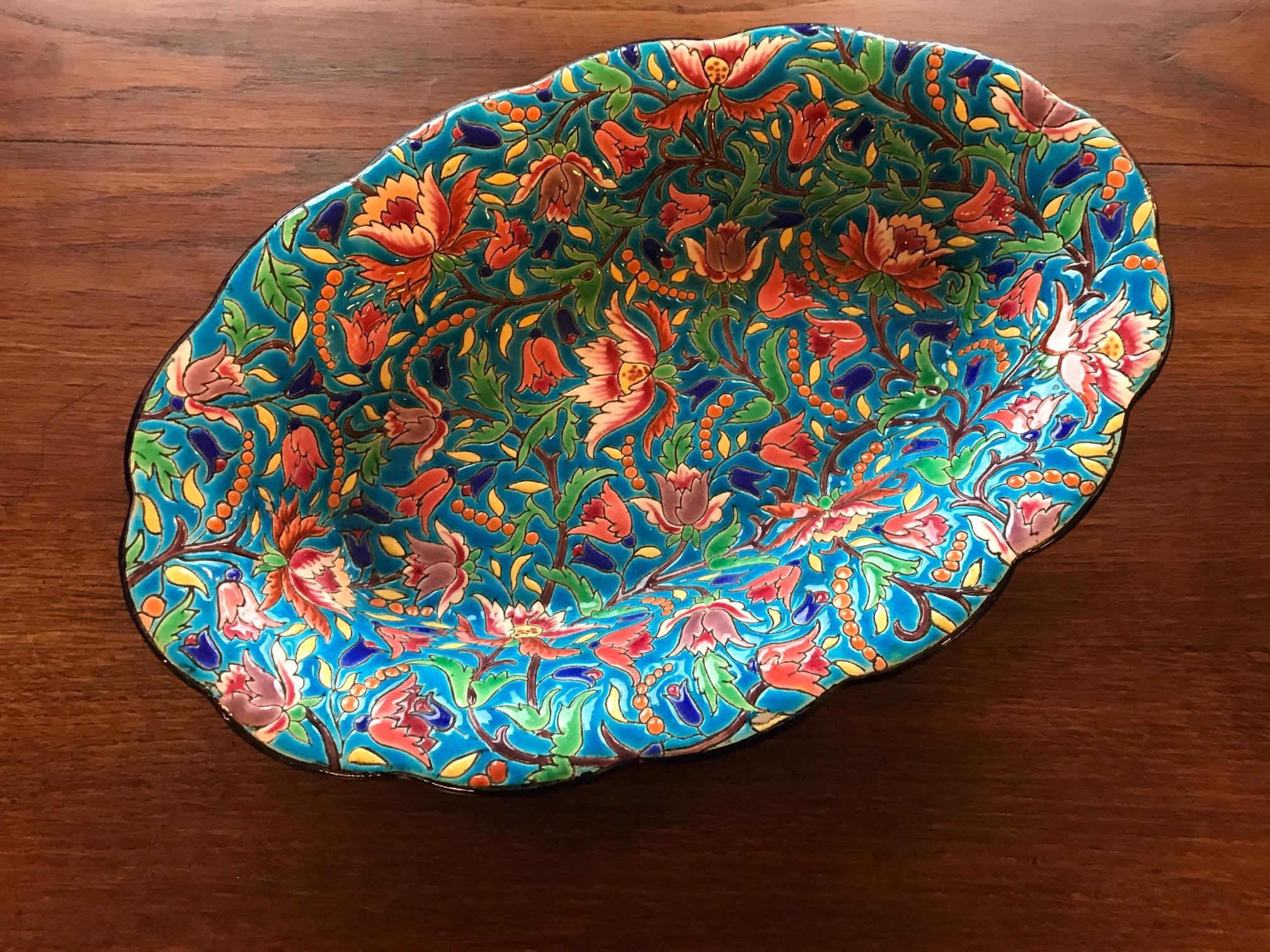 Very nice 20th century French Longwy faience serving platter in bold colors of blues, reds and browns with traditional Longwy border. Hand painted.
Fully marked by the traditional maker including the initials of the painter.